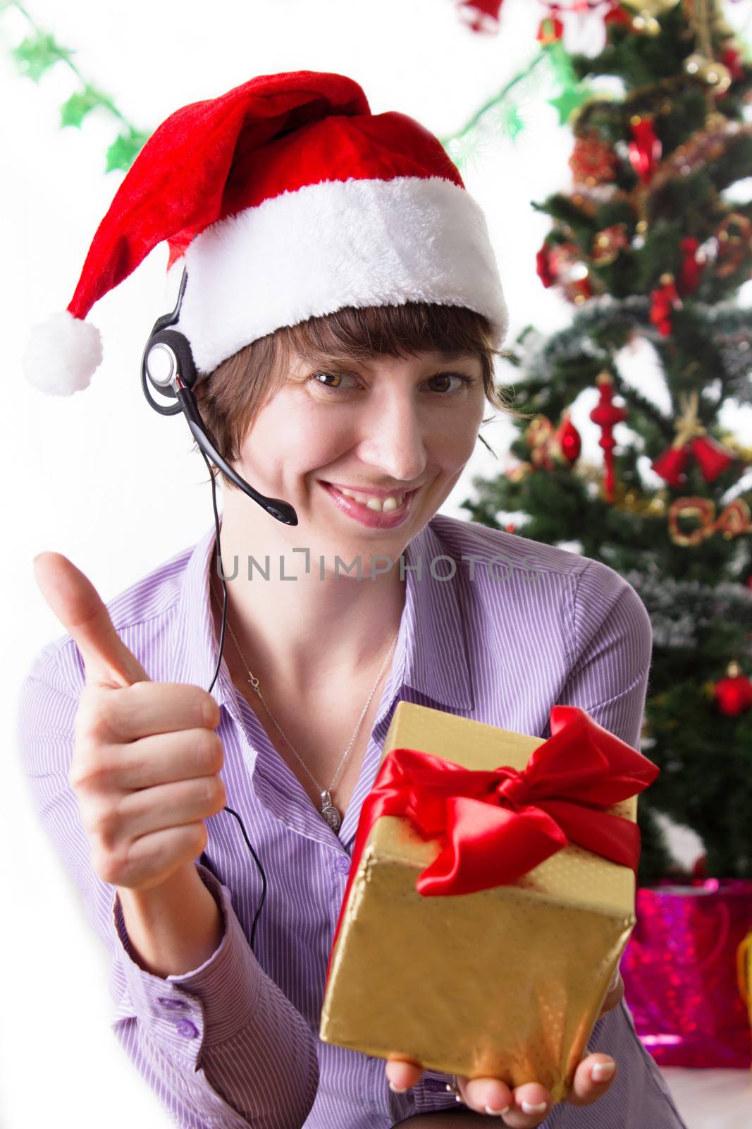 Service operator on Christmas back showing ok sign with present by Angel_a