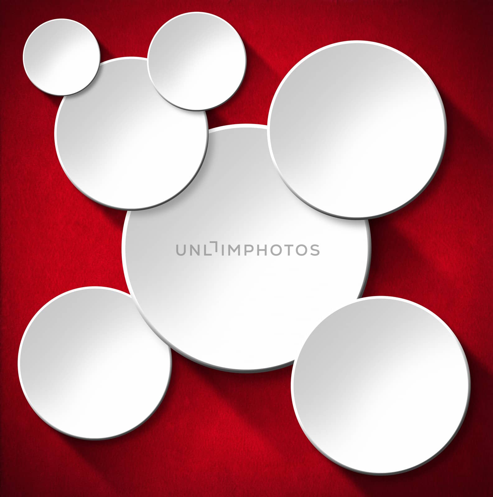 Some white empty circles with shadows on red velvet background