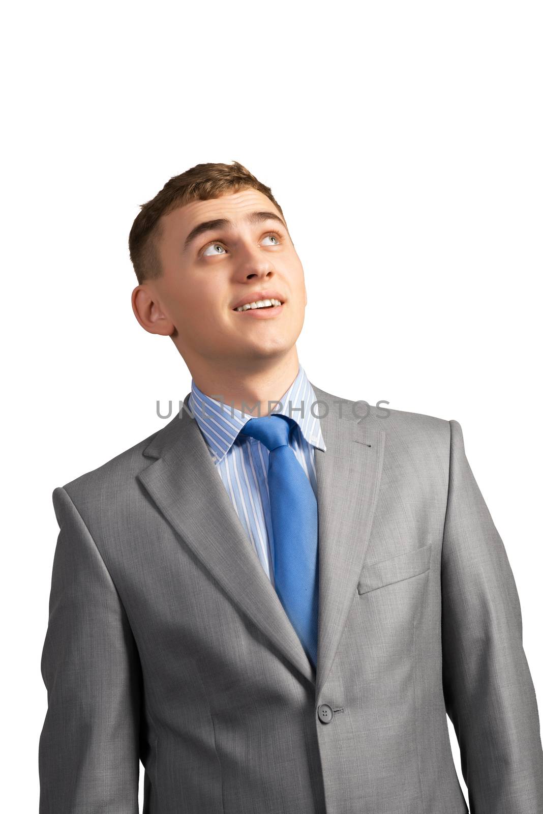 portrait of a young businessman thinking and looking up on gray background, isolated on white background