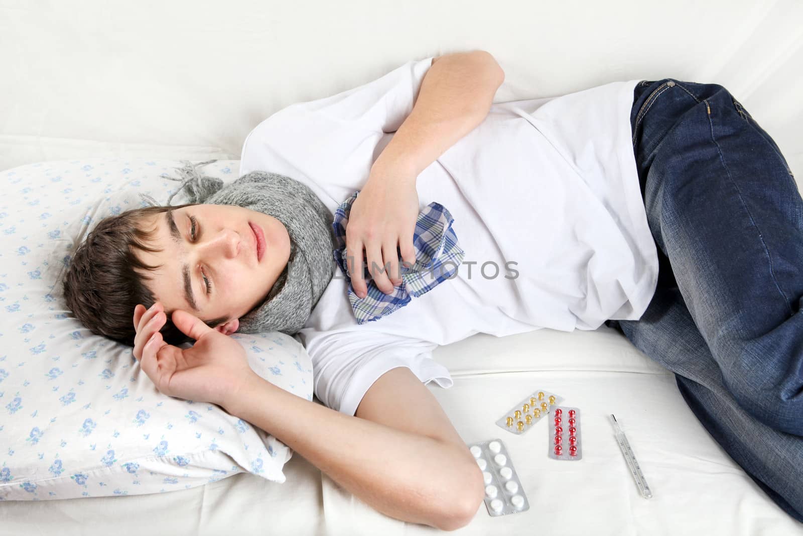 Diseased Young Man lying on the Bed