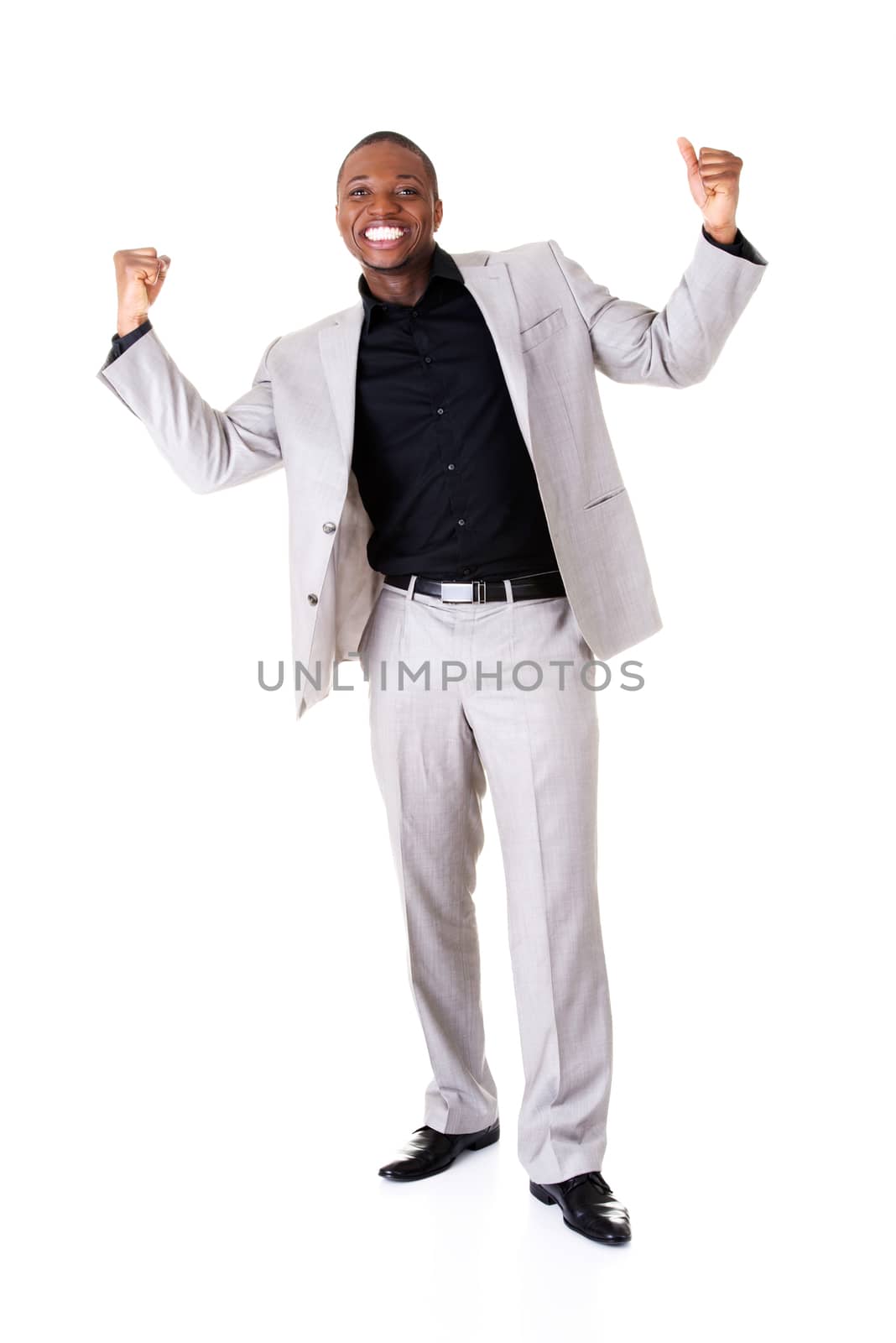 Male businessman with hands up, smiling. Isolated on white.