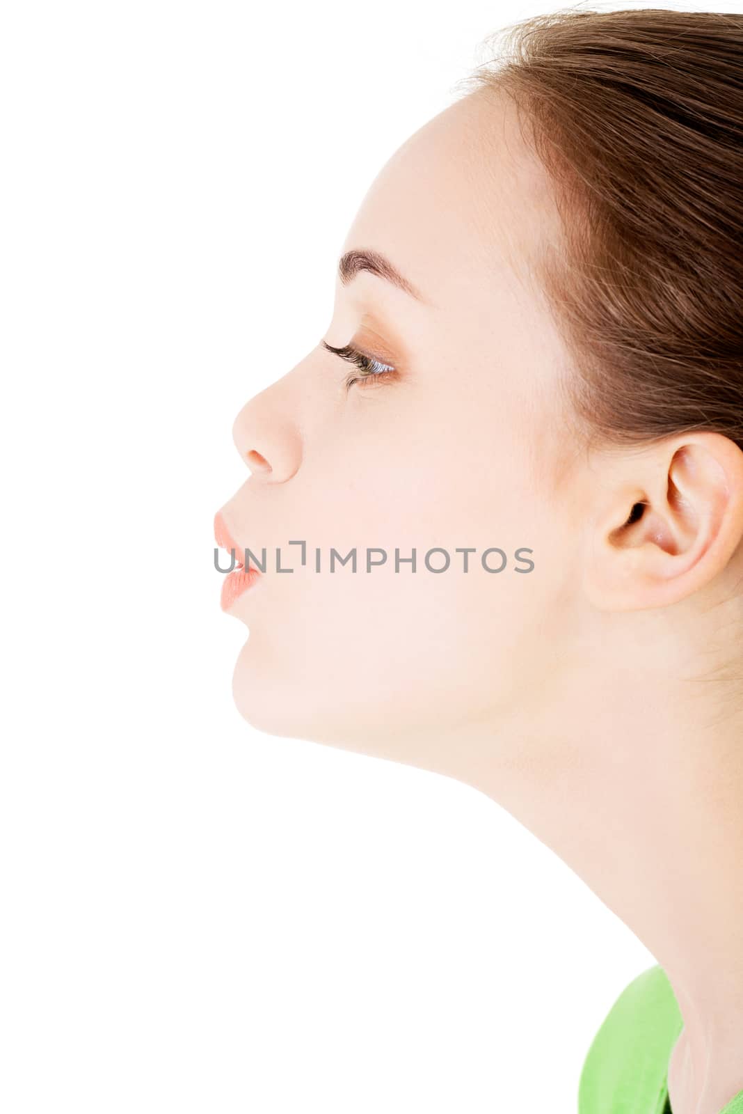 Attractive woman's profile. Closeup. Isolated on white.