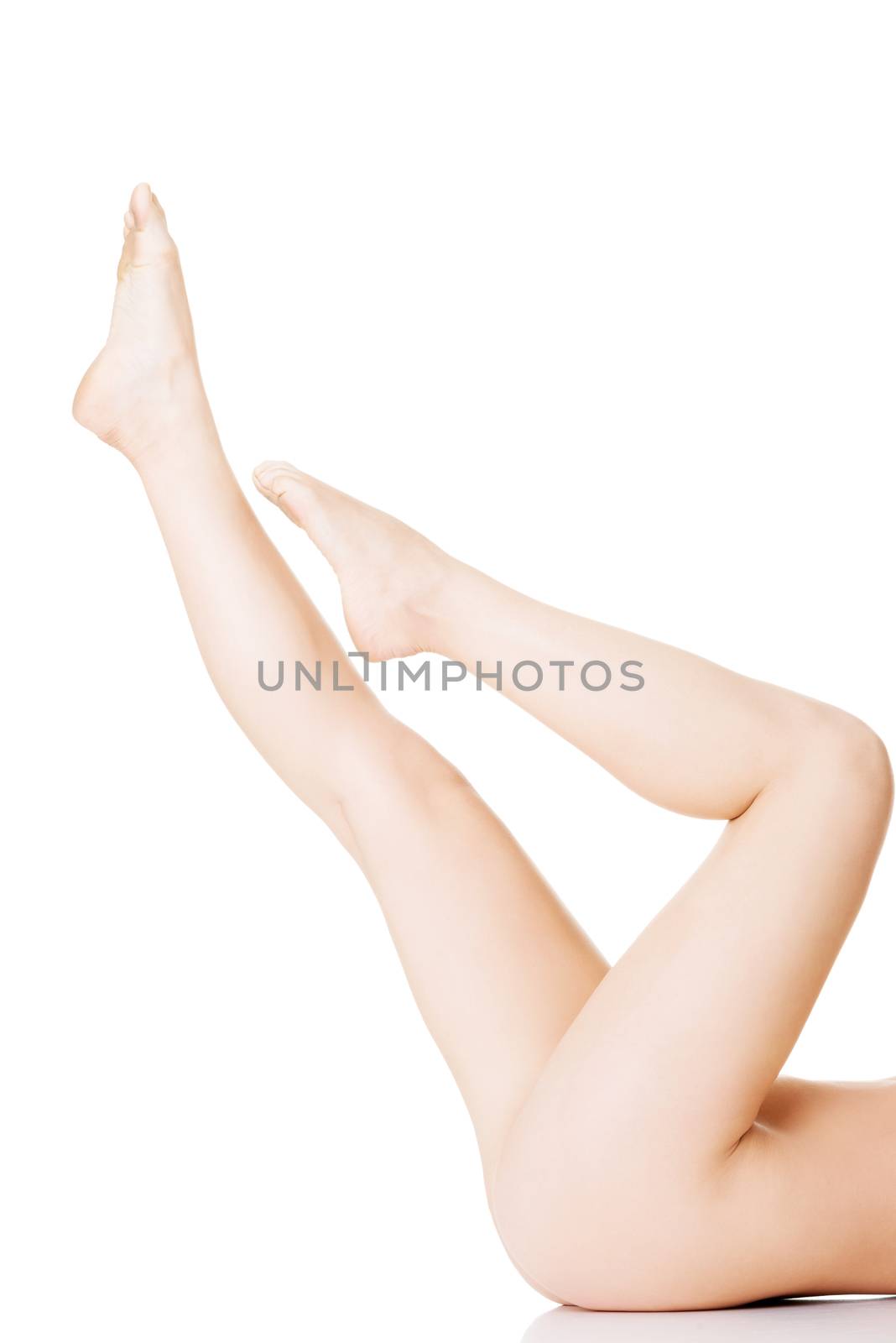 Womans, female sexy legs up. Closeup. Isolated on white.