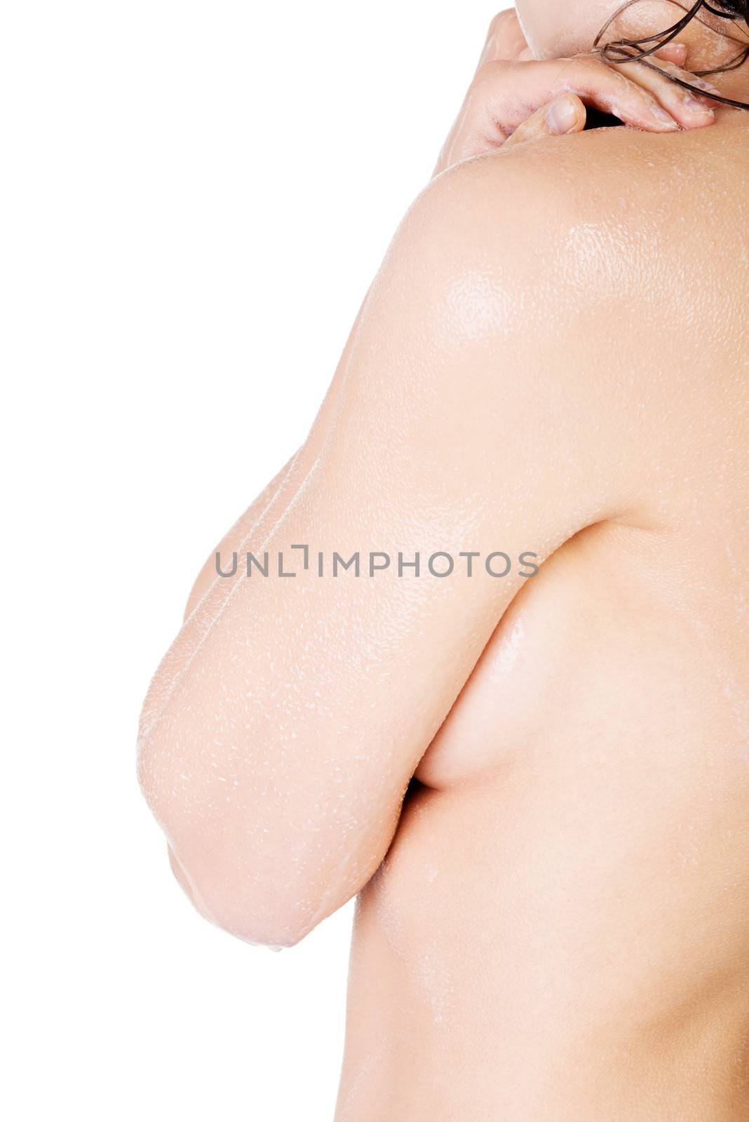 Woman's body side view. Closeup. Isolated on white.
