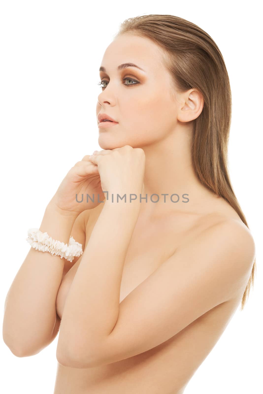 Attractive naked woman with hands close to face. Isolated on white.