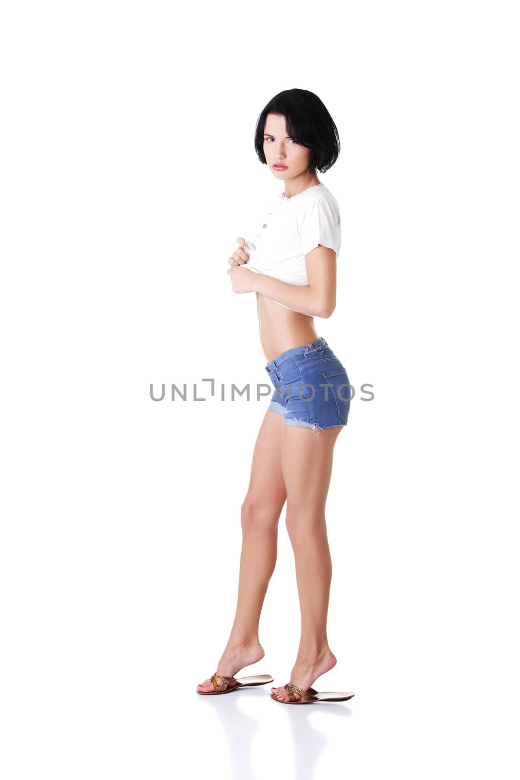 young attractive woman in shorts and tshirt. by BDS