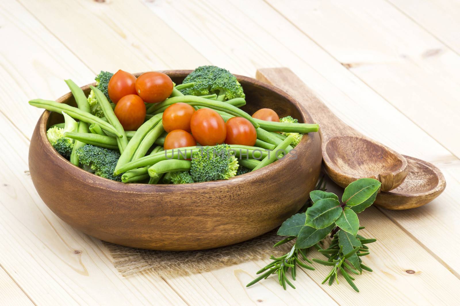 Vegetables and herbs: broccoli, green beans and tomatoes in a bowl