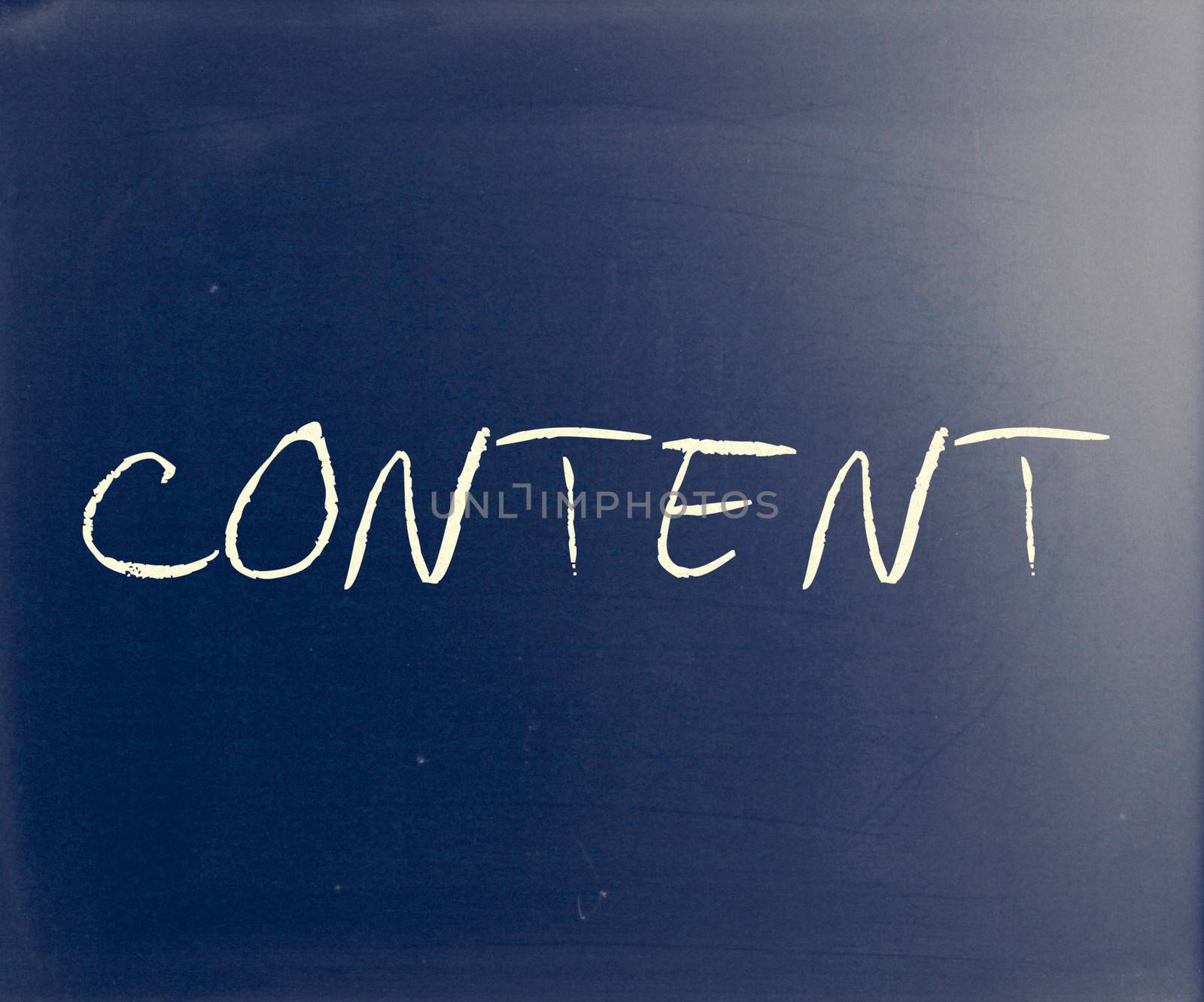 The word "Content" handwritten with white chalk on a blackboard by nenov