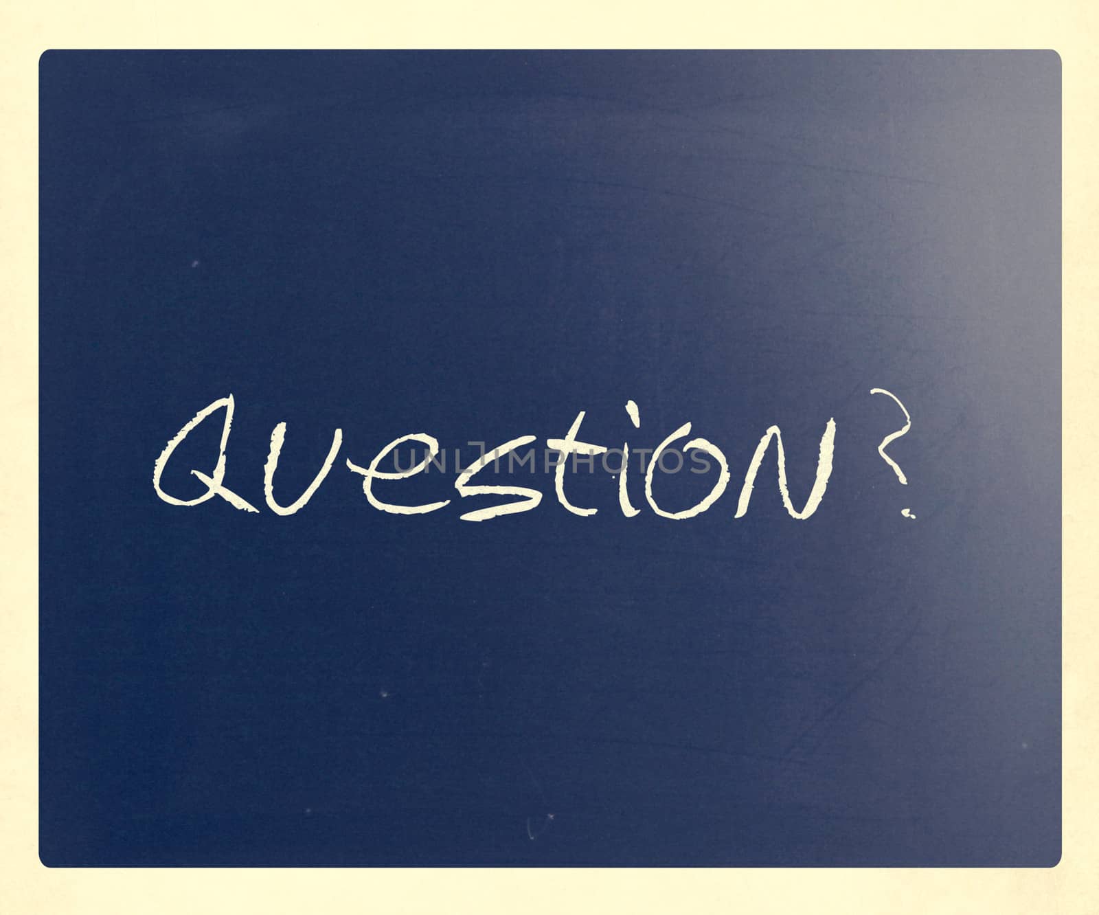 "Question" handwritten with white chalk on a blackboard.