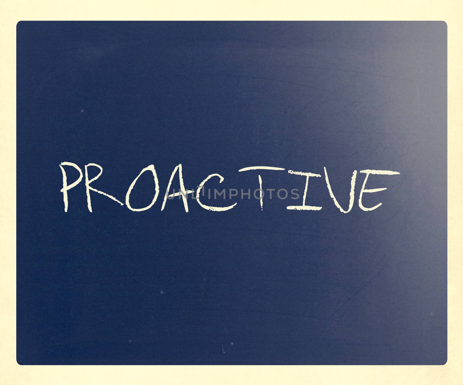 The word 'Proactive' handwritten with white chalk on a blackboard.