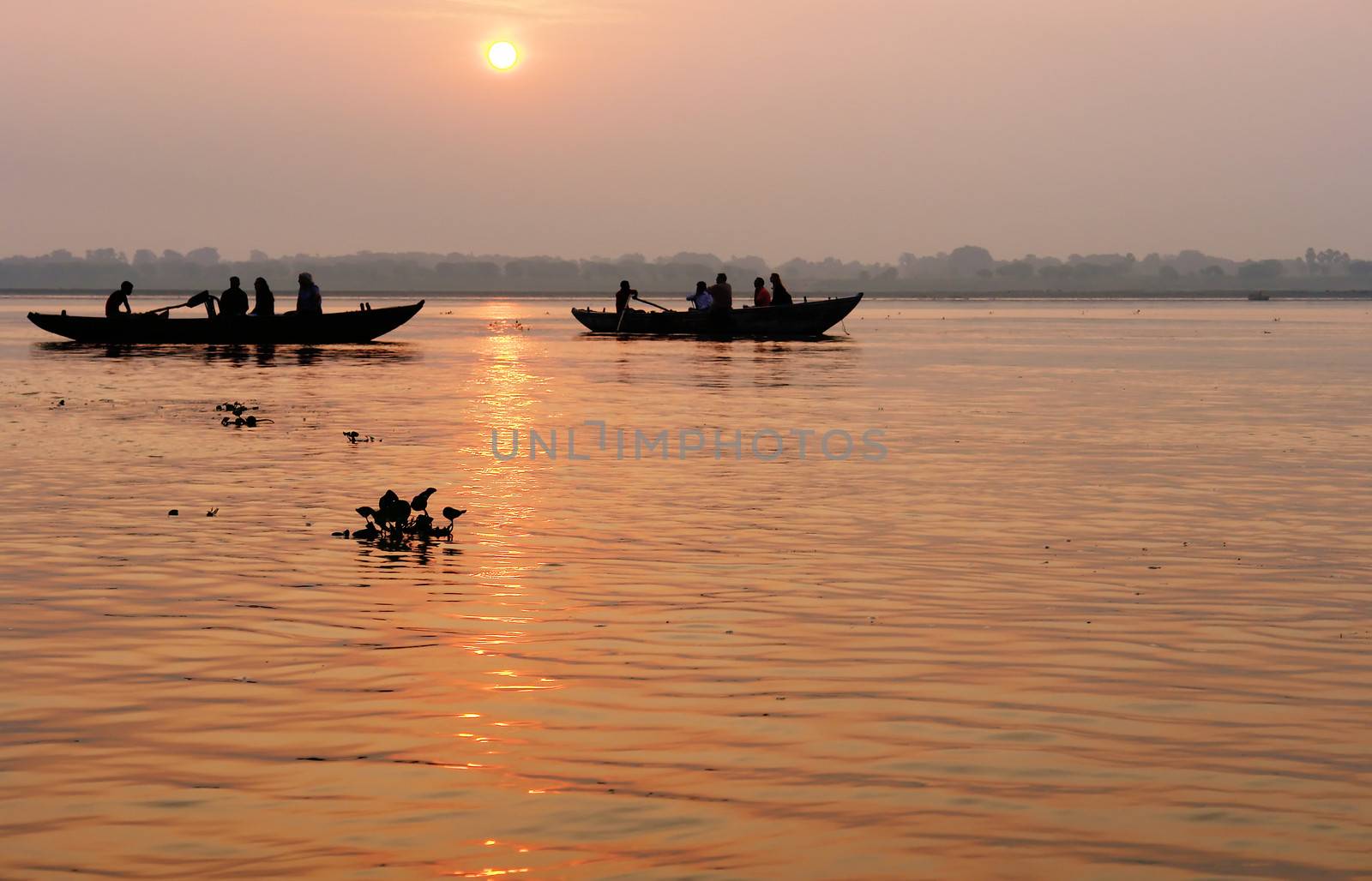 Tradicional boat trip in ganjes river at sunrise by ptxgarfield