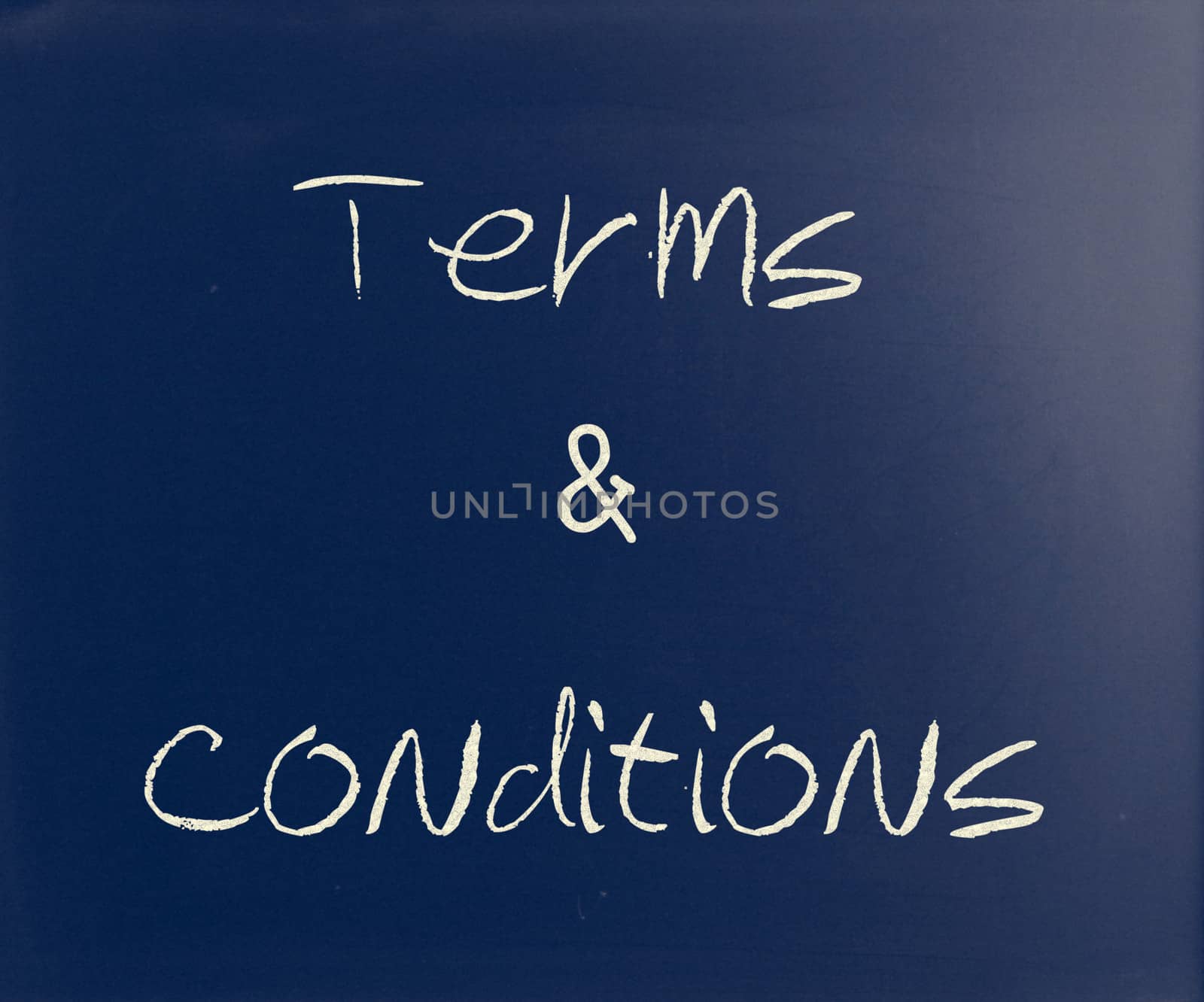 "Terms & Conditions" handwritten with white chalk on a blackboard.