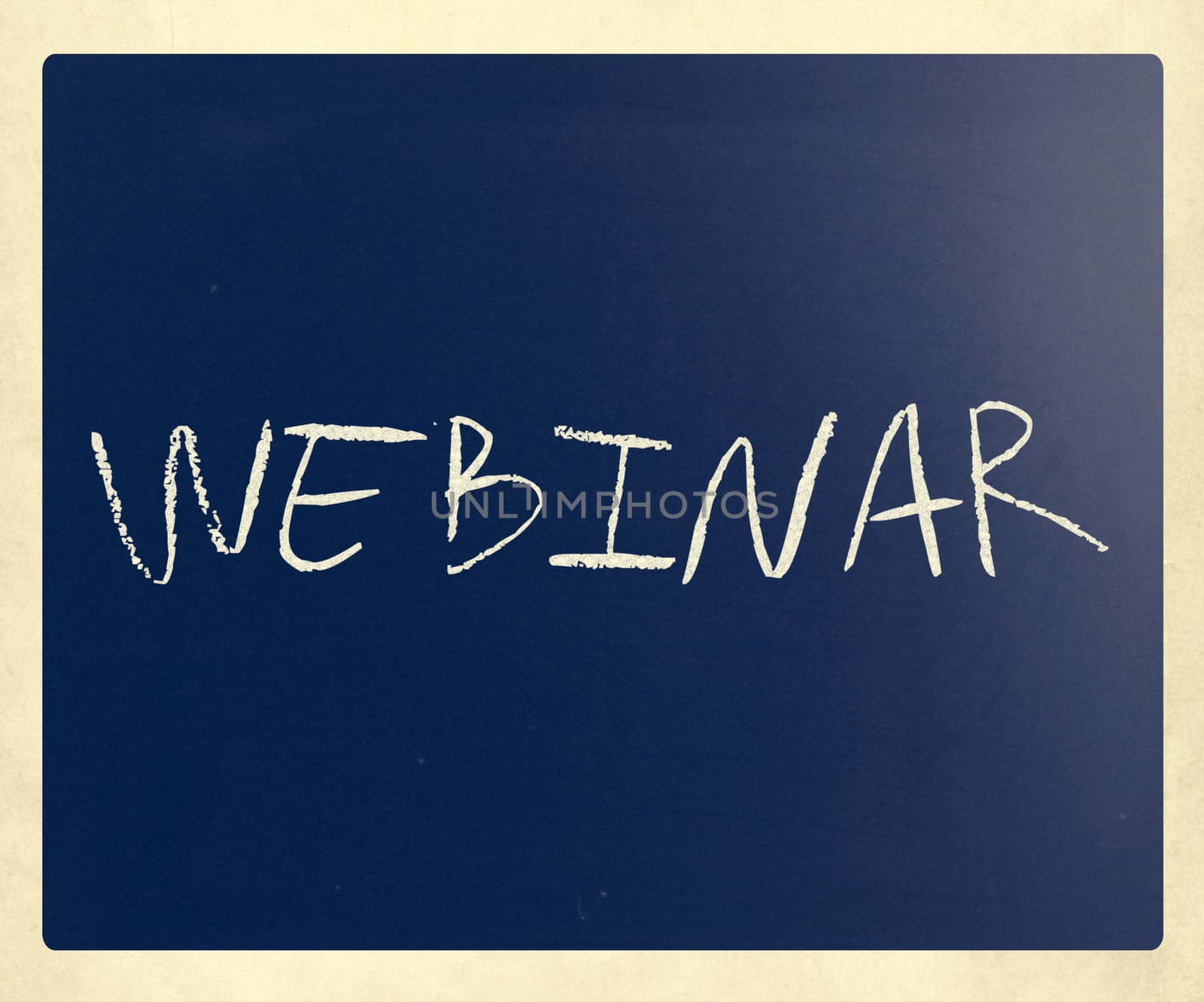 The word "Webinar" handwritten with white chalk on a blackboard.