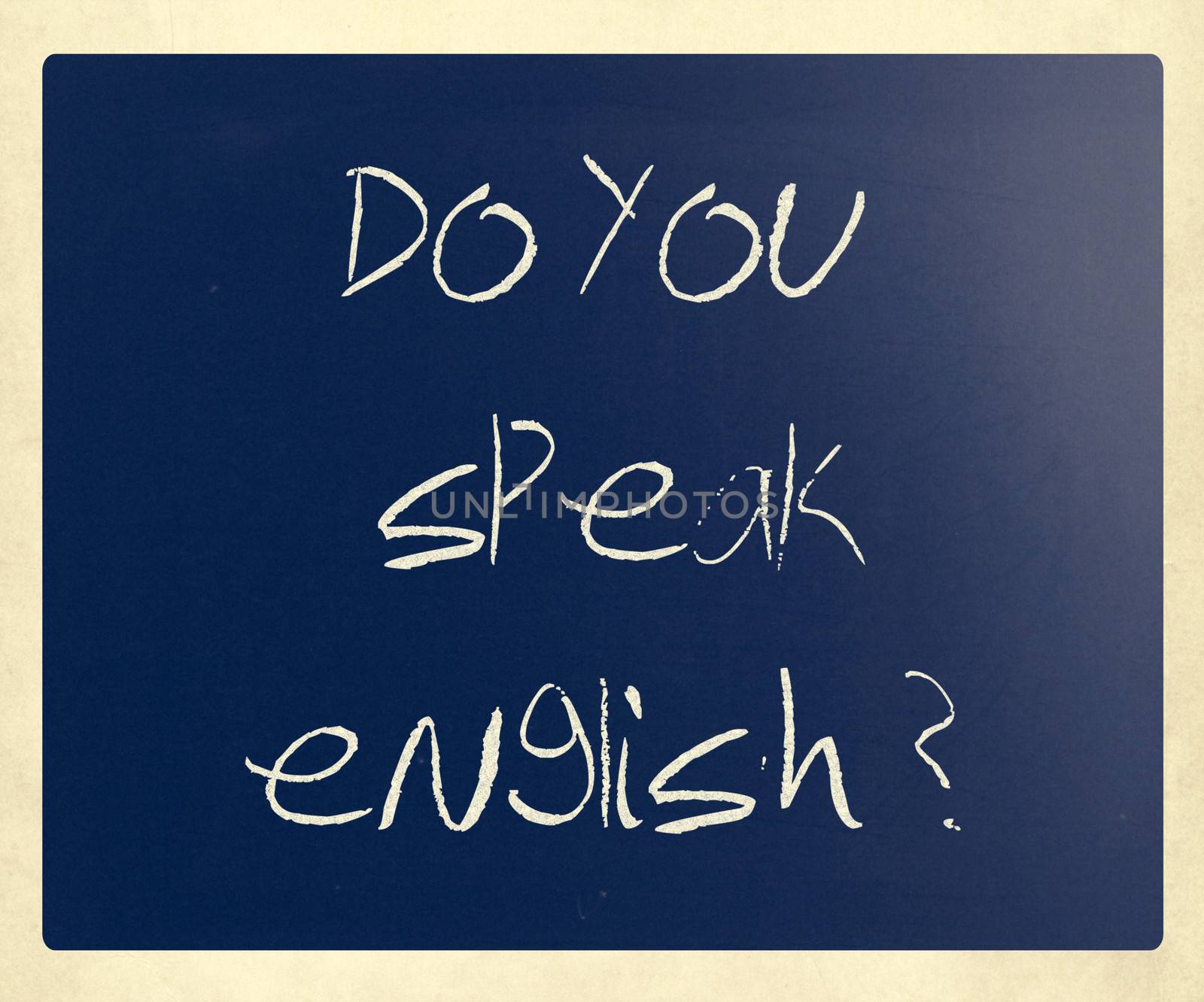 "Do you speak english" handwritten with white chalk on a blackboard.