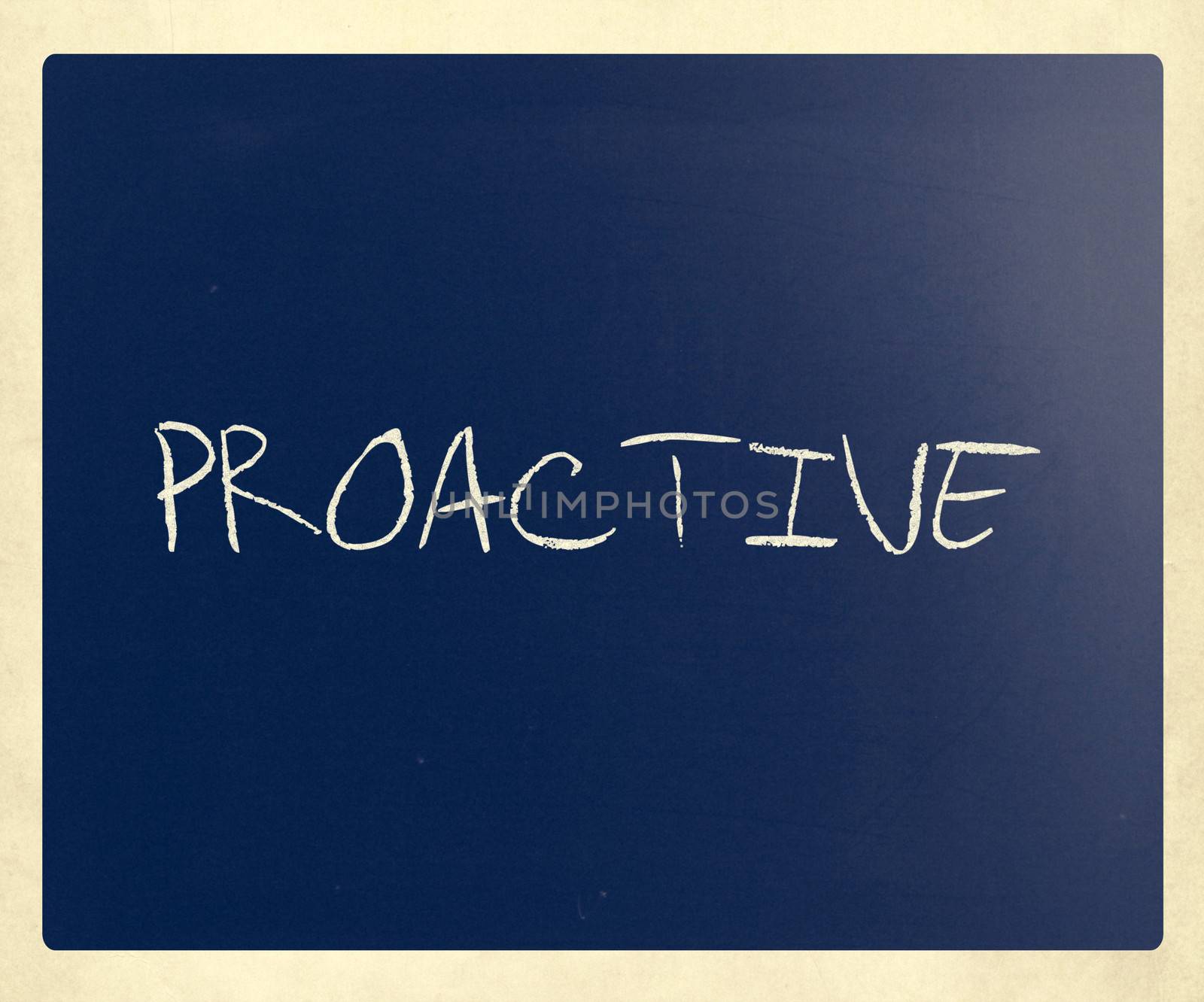 The word 'Proactive' handwritten with white chalk on a blackboard.