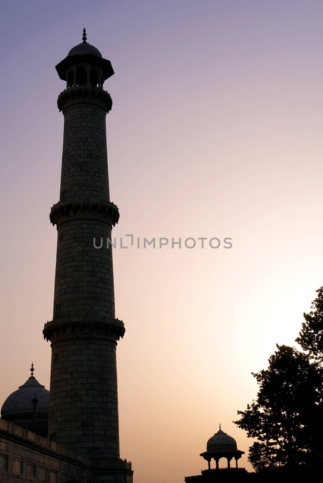 Moslem fortress silhouette at sunrise. Taj Mahal, Agra, India
