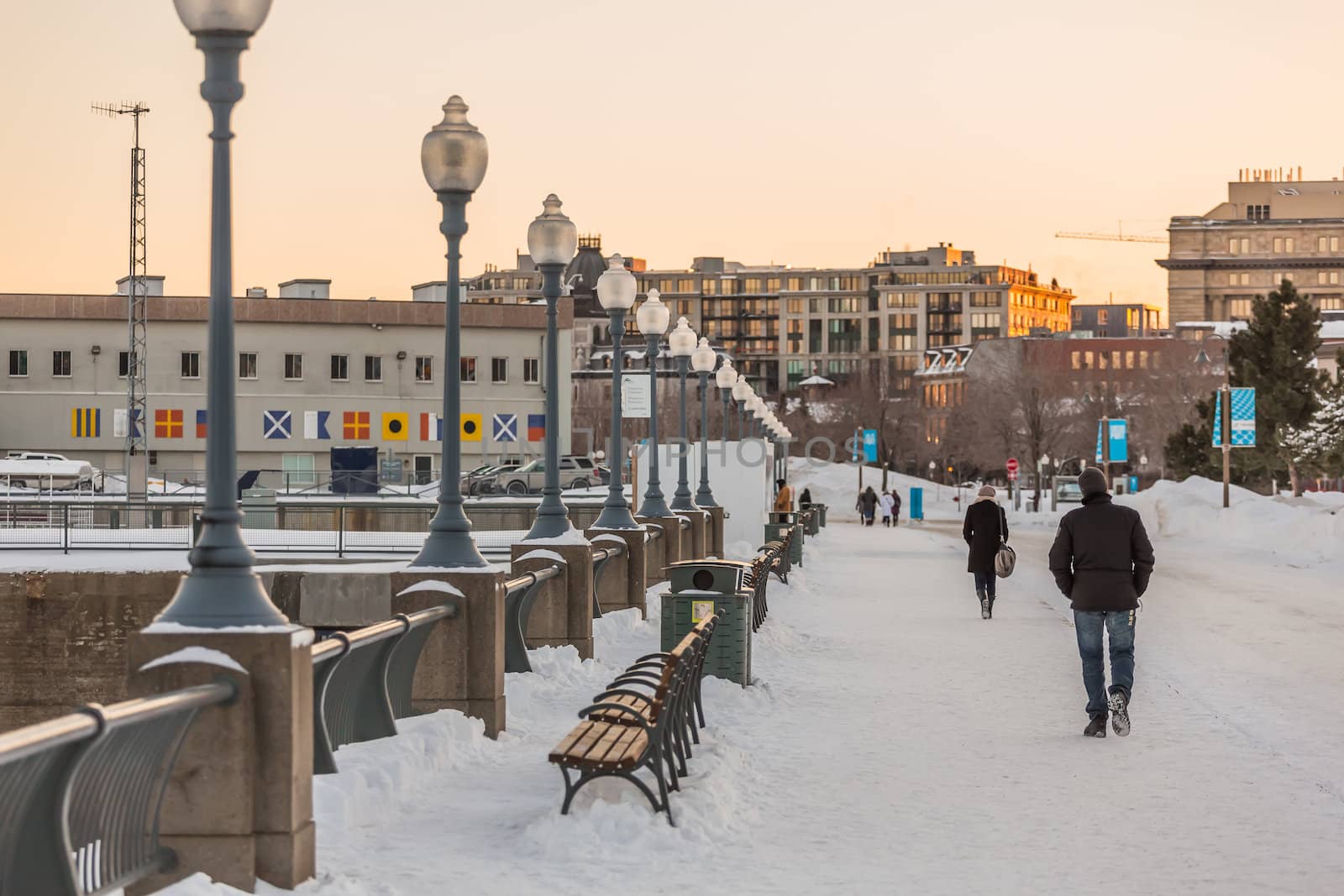 A street with people in Montreal on a winter evening, Quebec, Canada