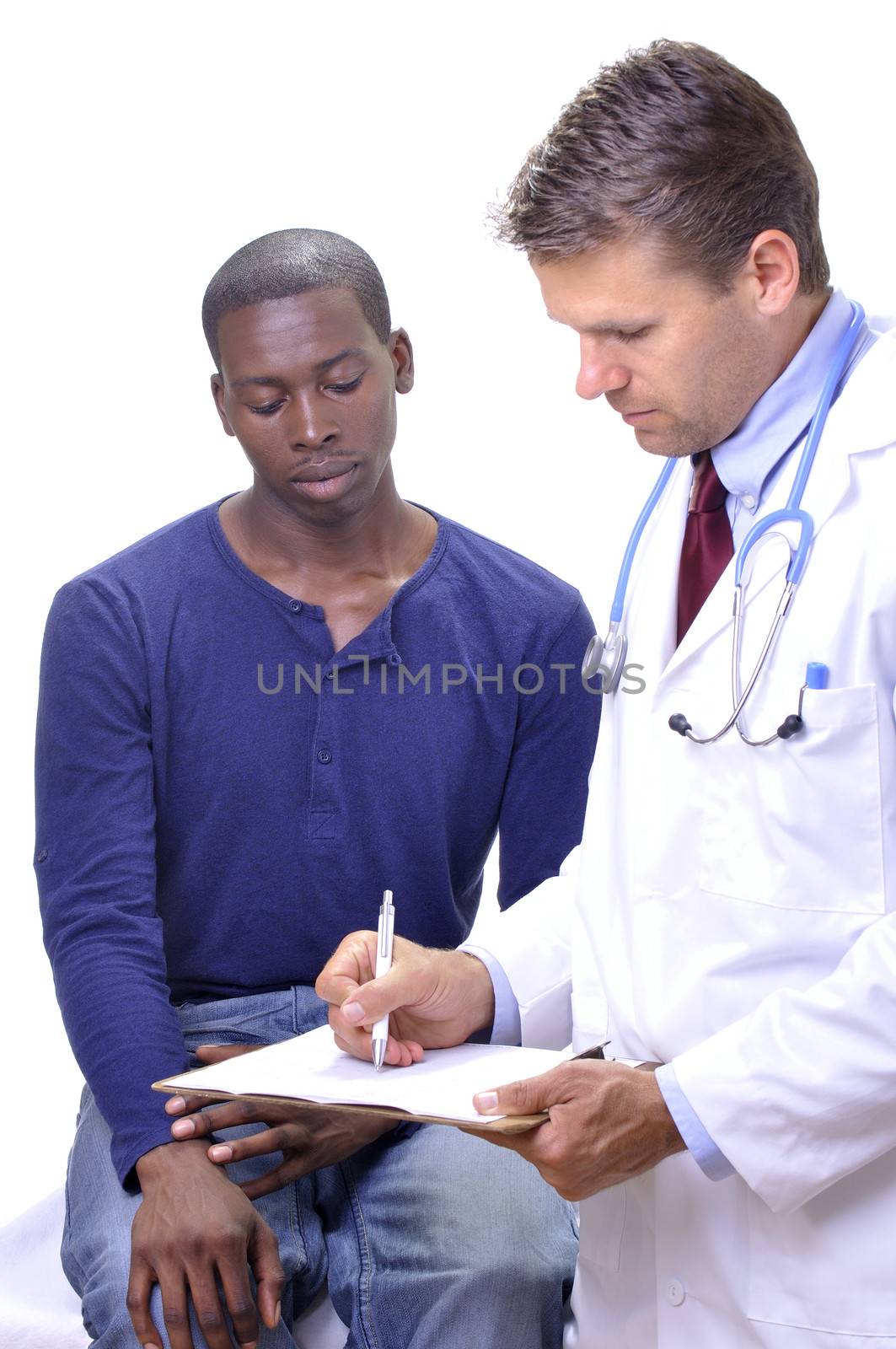 Medical doctor in white lab coat consults with his young patient on white background