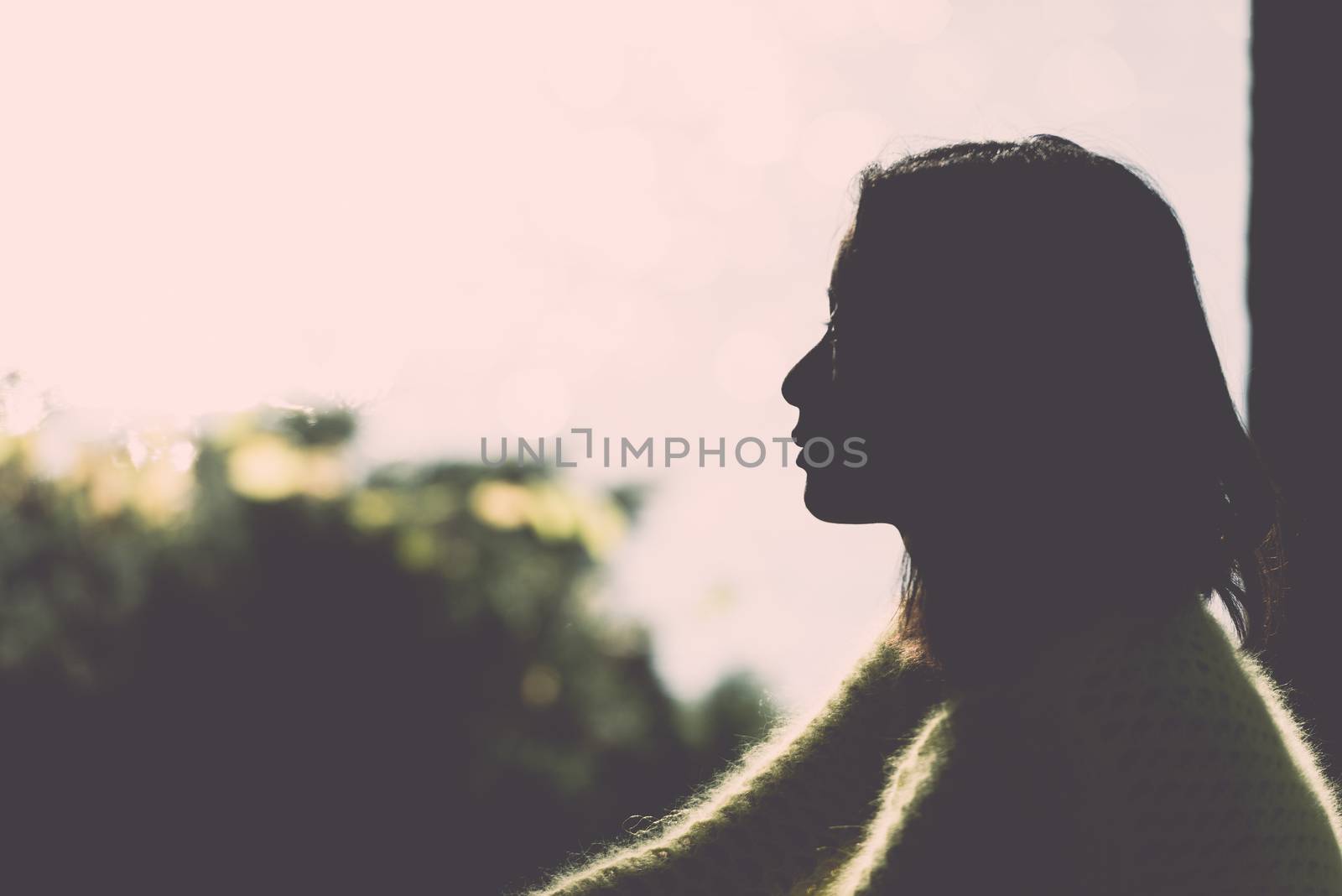 Silhouette of lonely woman by IVYPHOTOS