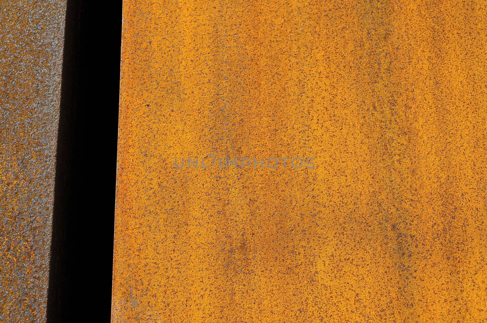 Orange Patterns on the Rusty Surface of the Metal