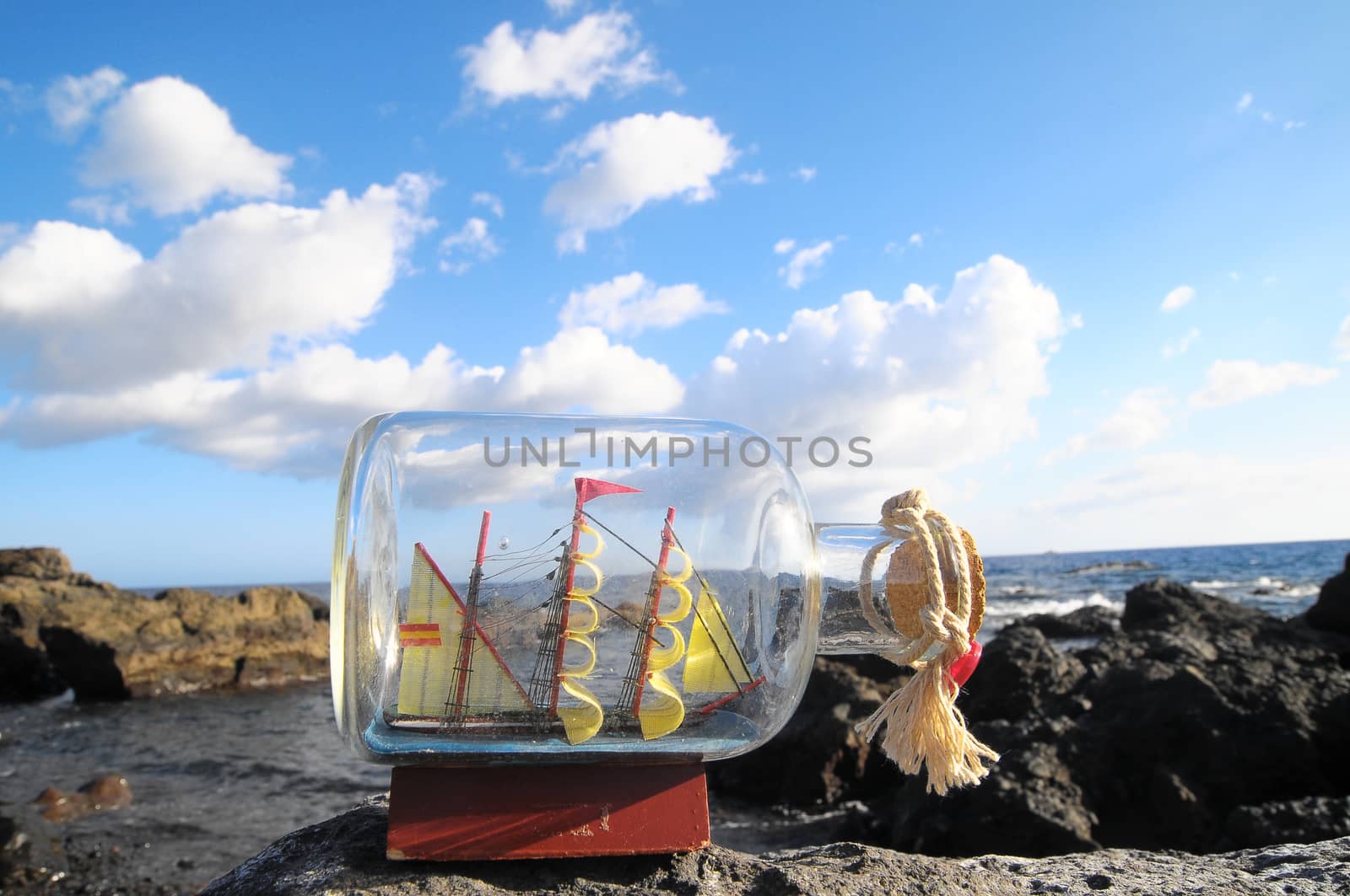 Ancient Spanish Sailing Boat in a Bottle near the Ocean