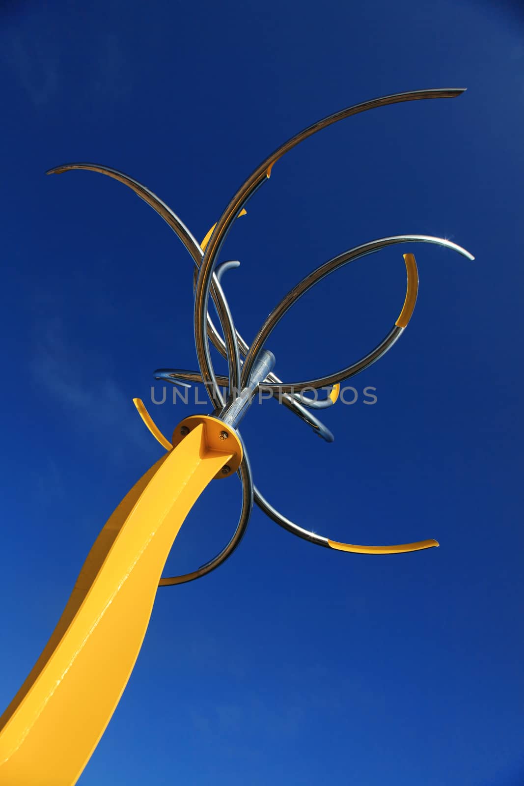 Bondi - Tamarama Beach, Australia - November 9,  2013: Sculpture By The Sea, Bondi 2013. Annual cultural event that showcases artists from around the world  Sculpture titled 'like a flower swaying in the wind ' by Hiroyuki Kita (Japan).  Medium - stainless steel, steel ball bearings, paint  $60000