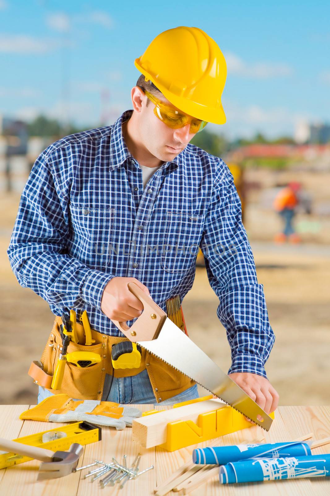 men cutting with hansaw