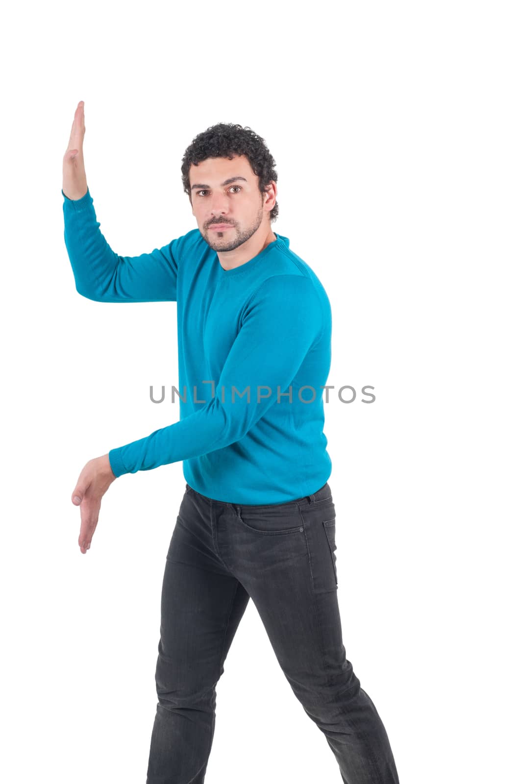 Man in blue t-shirt pushing invisible wall