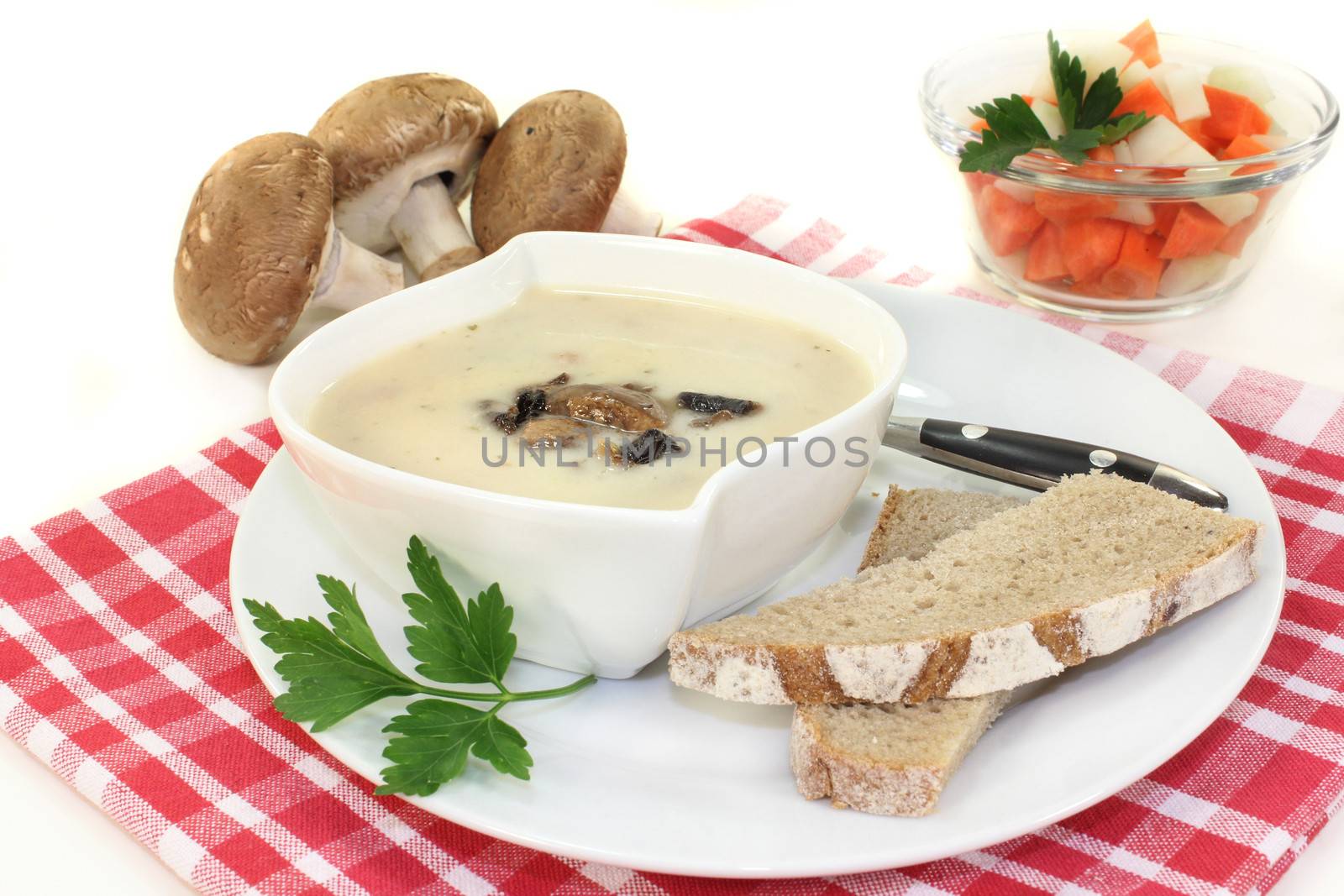 a bowl of veal cream soup with mushrooms