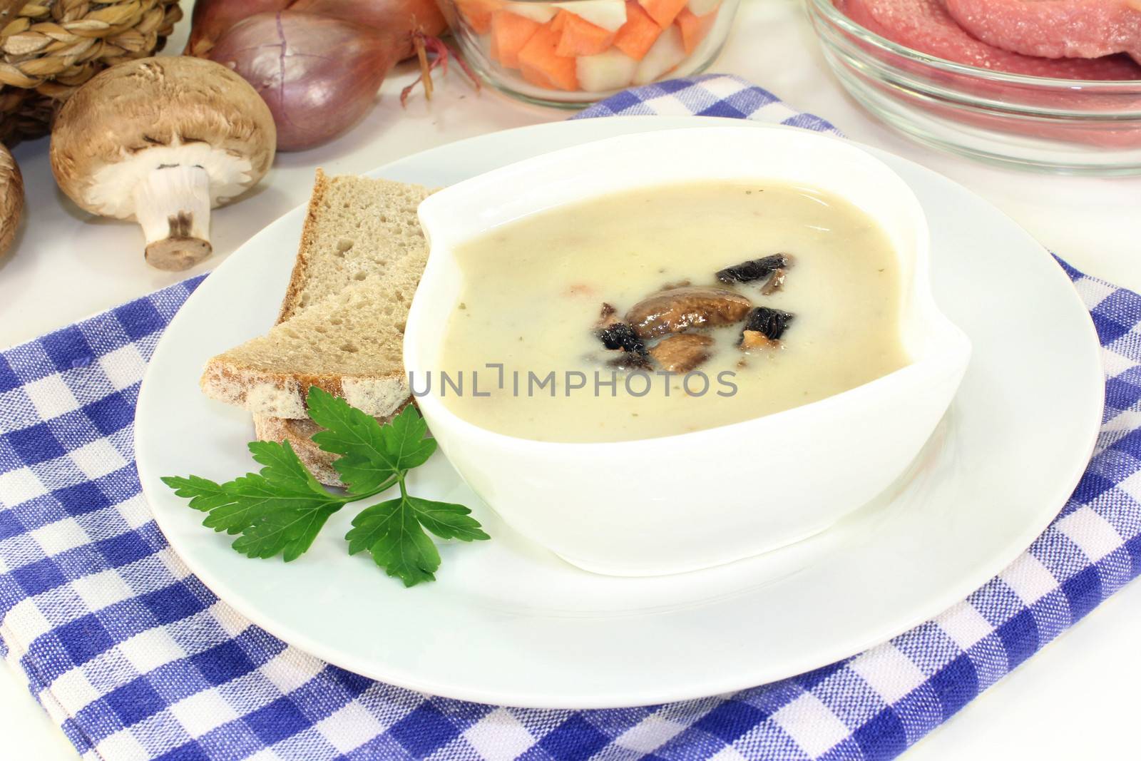 a bowl of veal cream soup with mushrooms