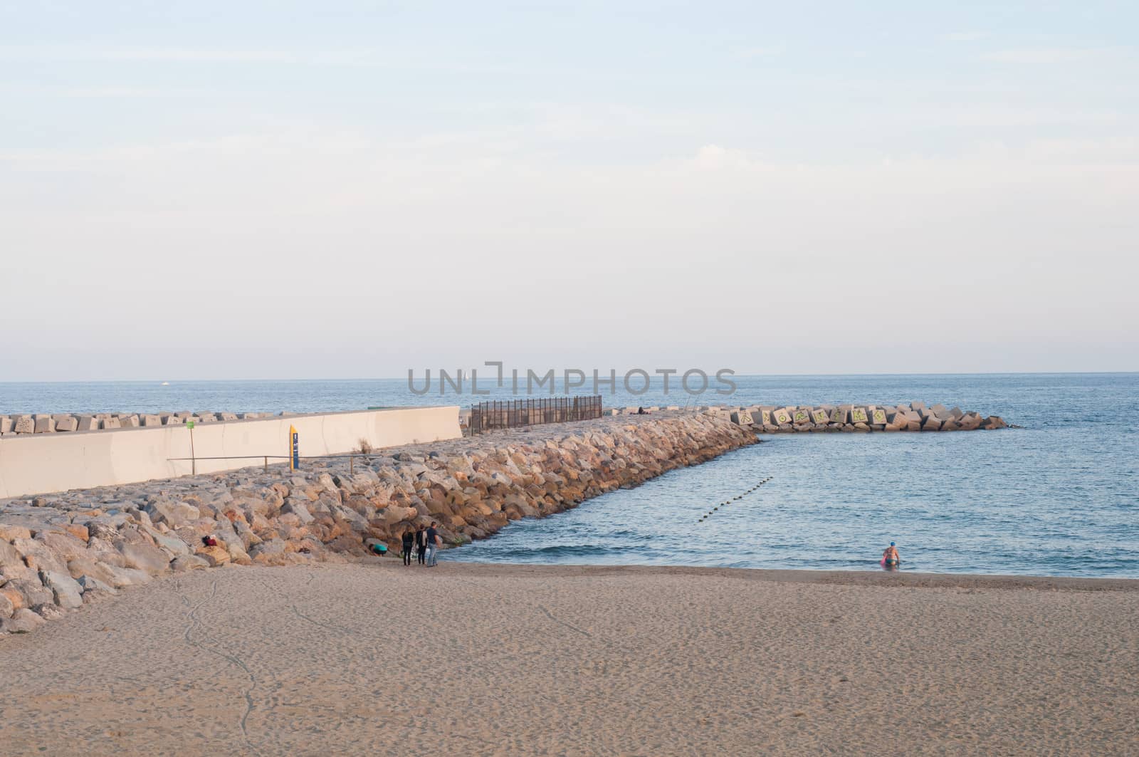 Sea landscape with sandy beach and pier