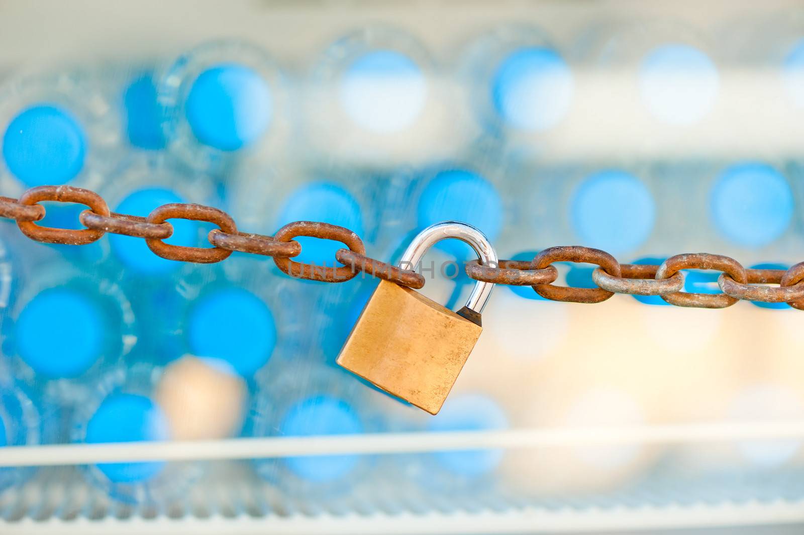 padlock and chain on the refrigerator with water