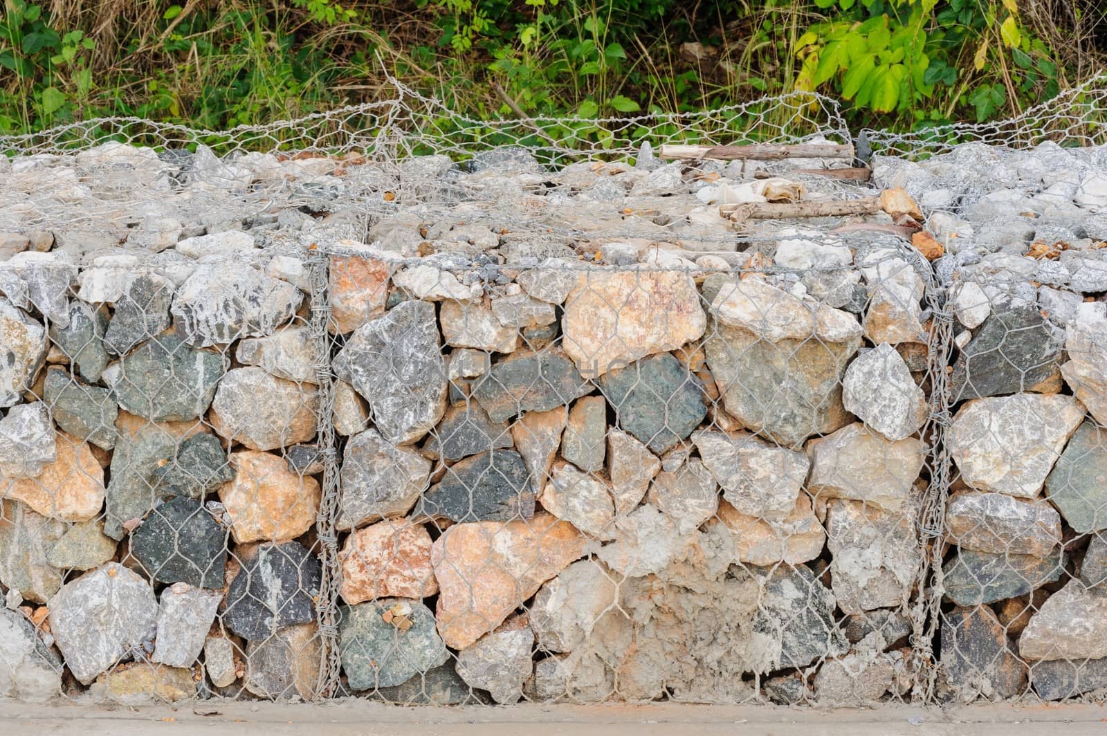 Rock blocks prevent landslides on site work.