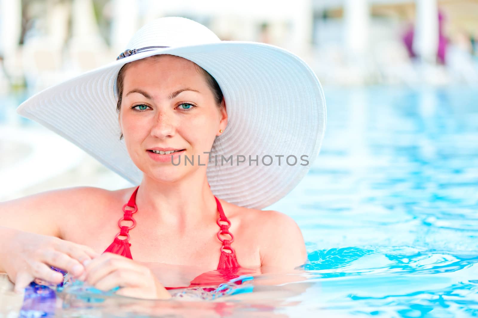 woman in a blue swimming pool water by kosmsos111