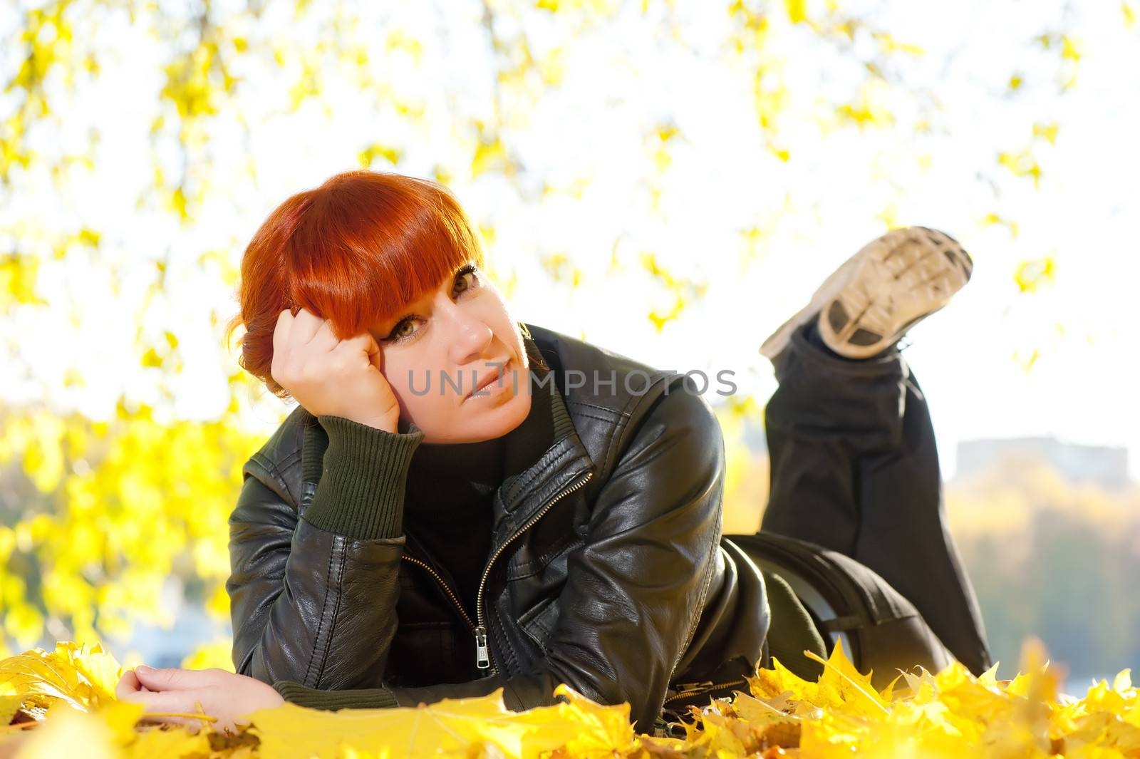 woman with red hair a rest in autumn park by kosmsos111