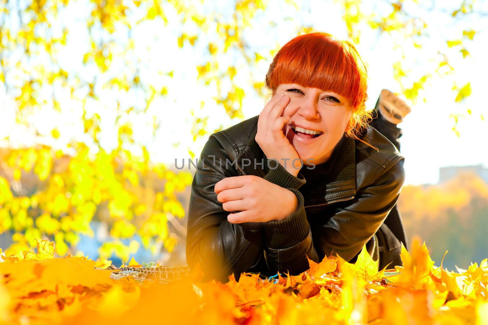 Girl resting in autumn park on a sunny day