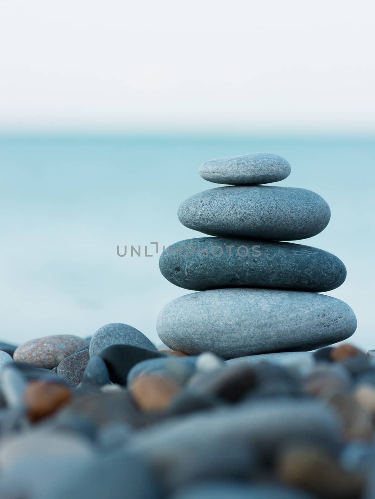 Stack of round smooth stones on a seashore