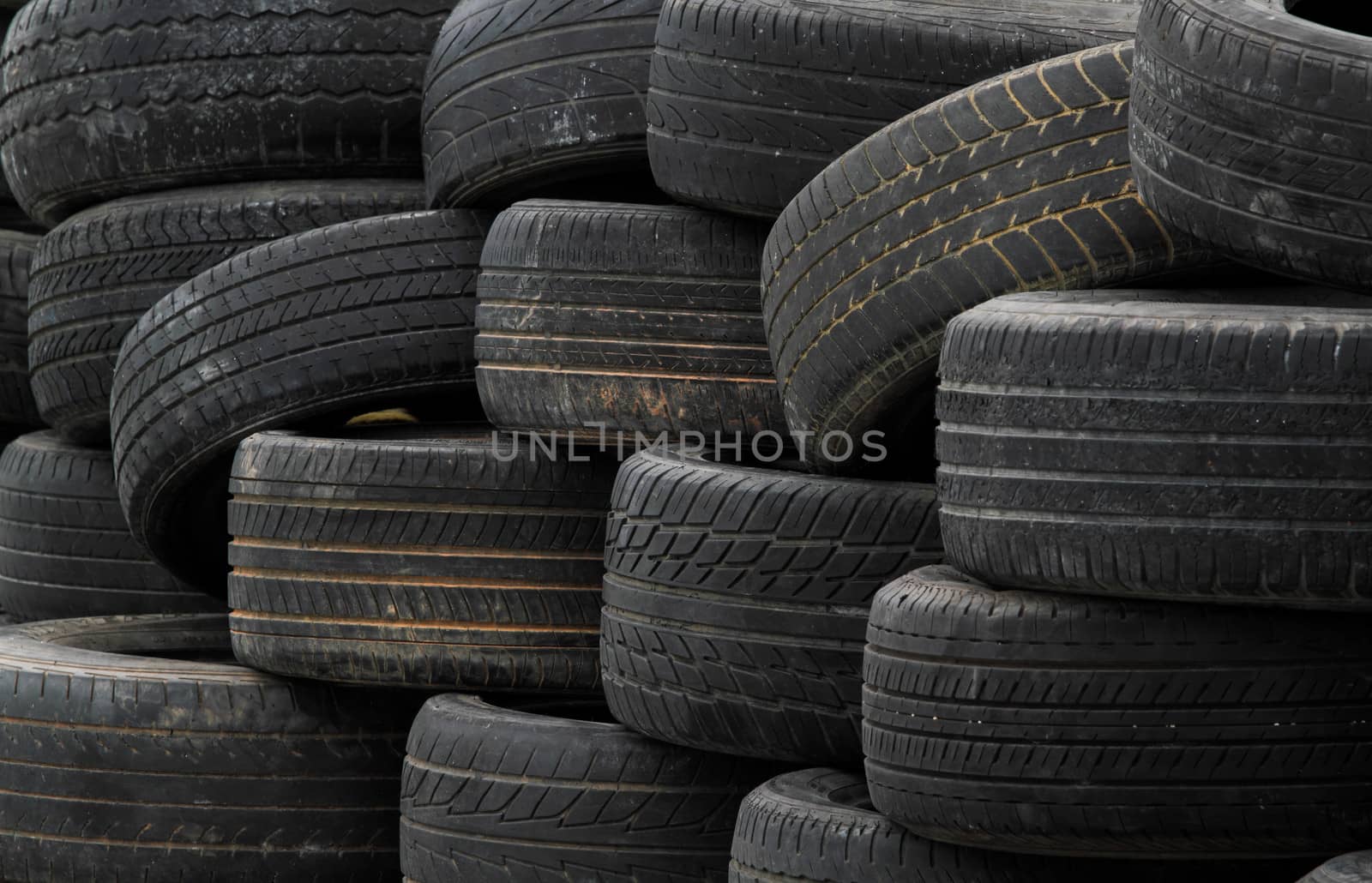 Pile of old rubber tires for background