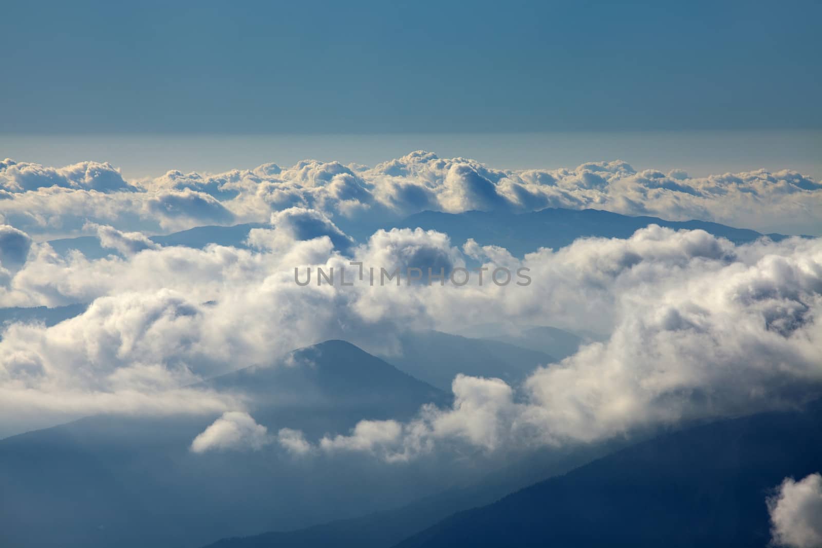 Misty mountain landscape above the clouds