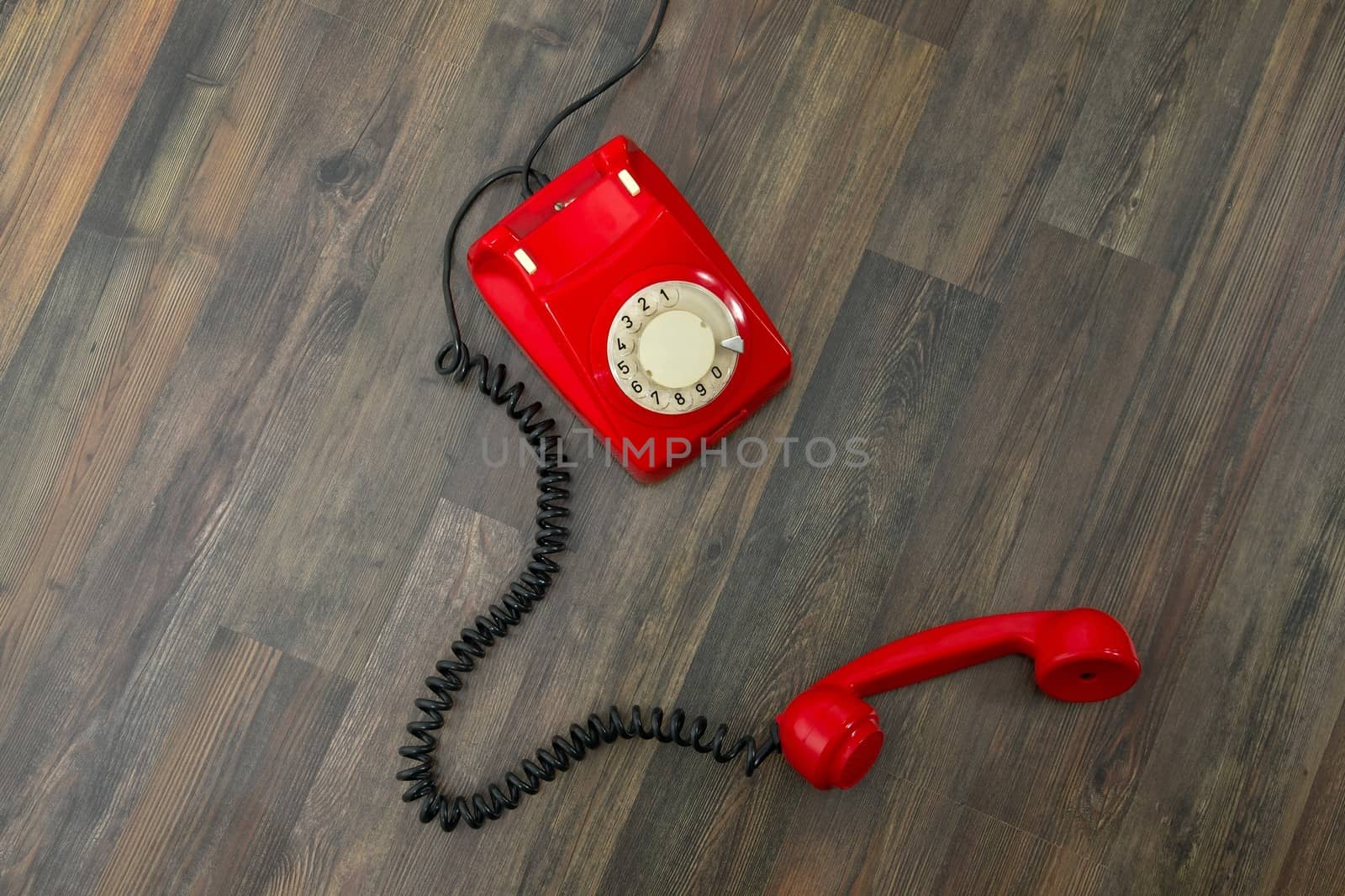 Red vintage phone on the floor