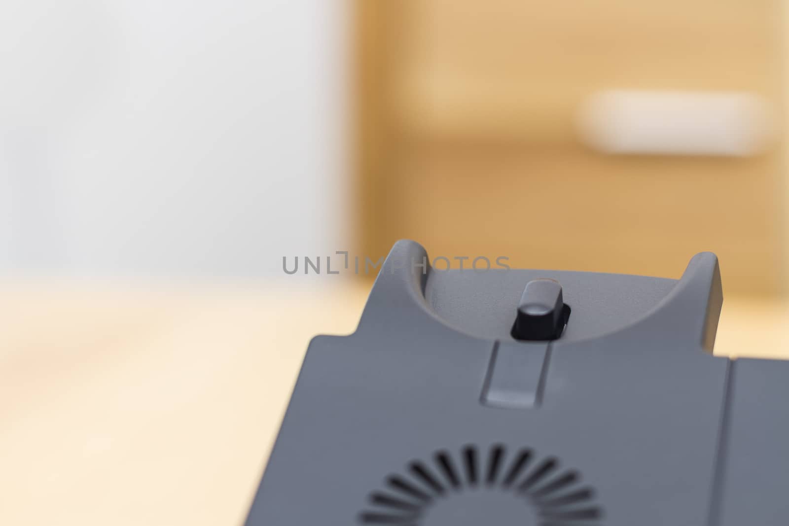 detail of modern voip telephone on wooden desk