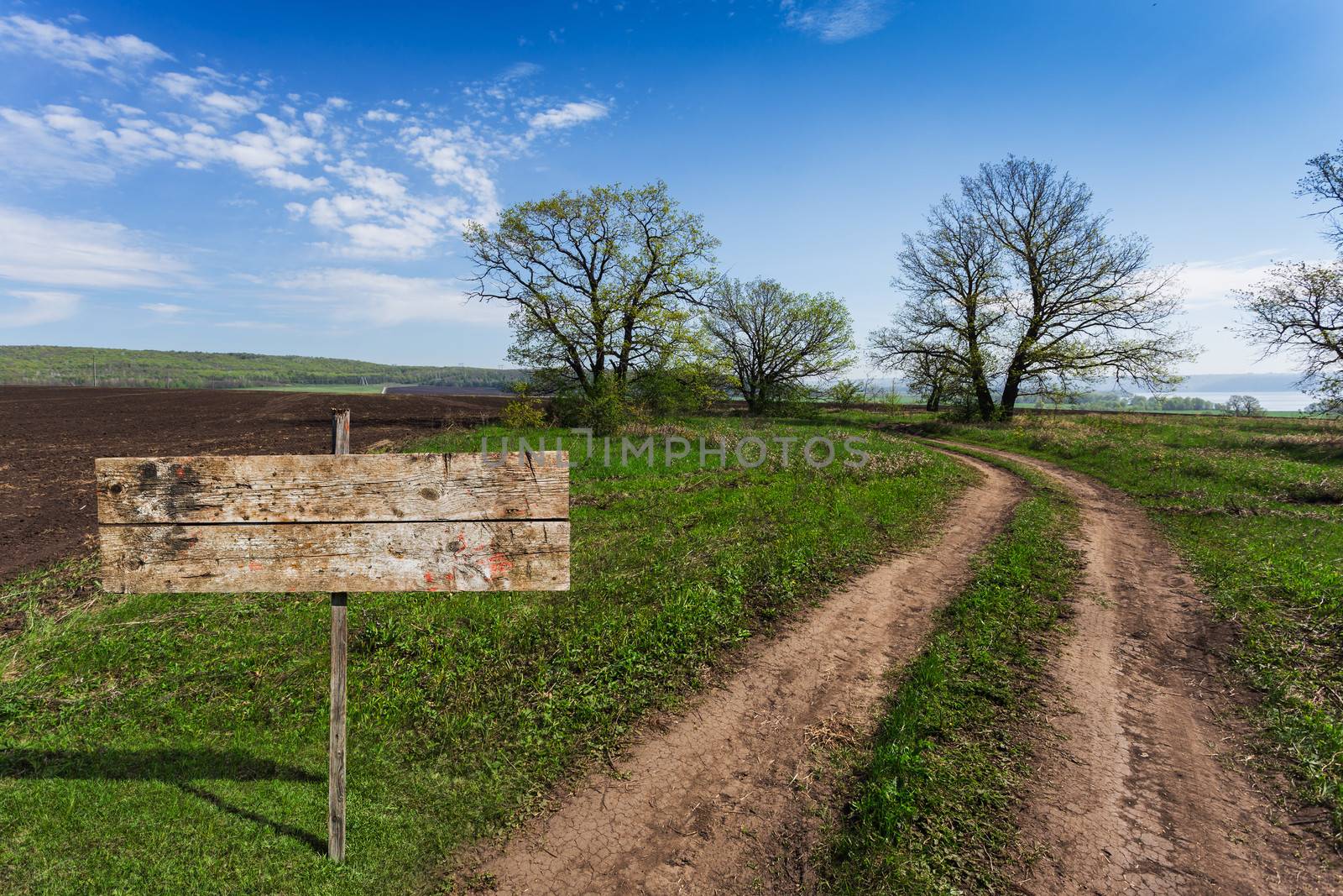 old wooden sign on a country road in rural areas