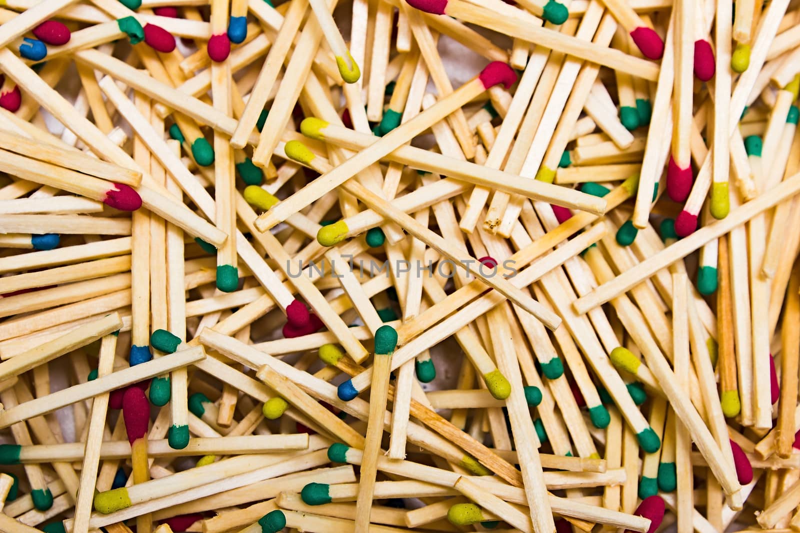 background of wooden matches with red and green heads