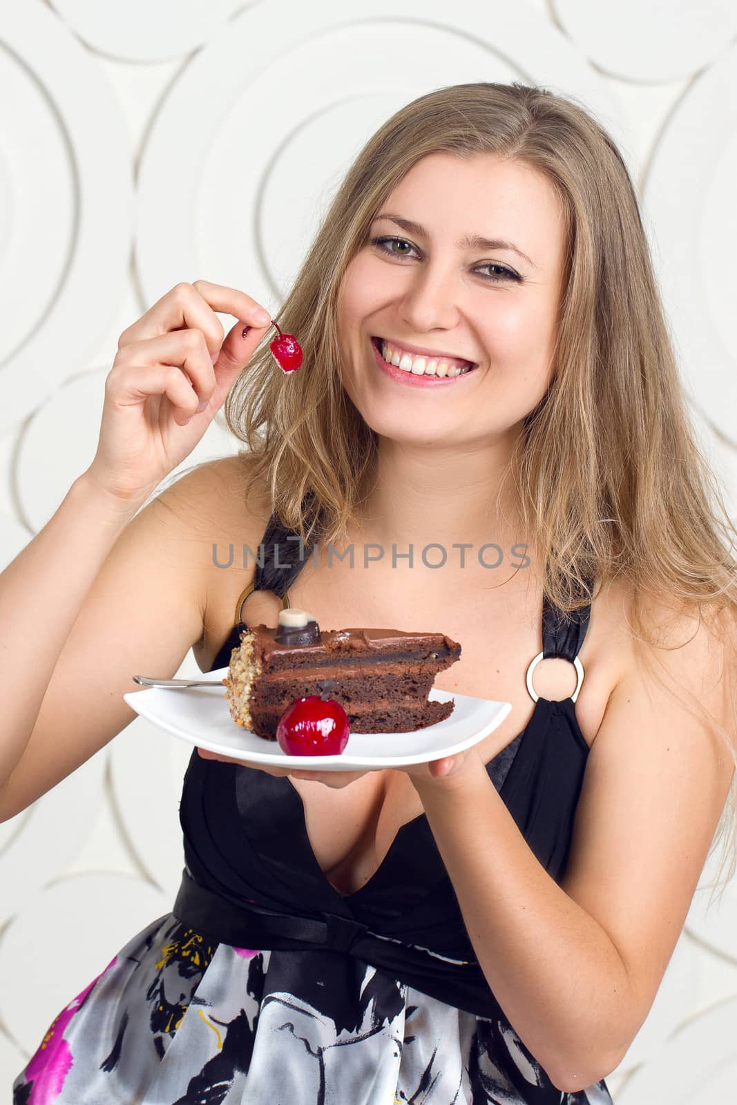 Portrait of young woman enjoying the cake