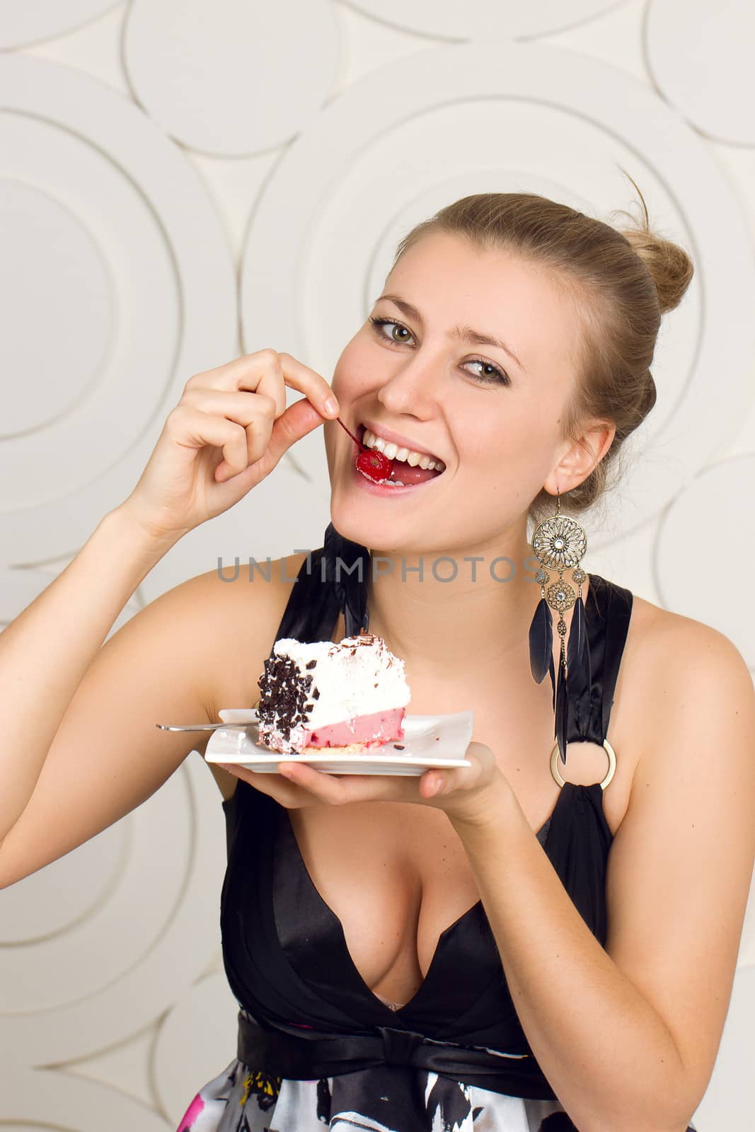 Portrait of young woman enjoying the cake