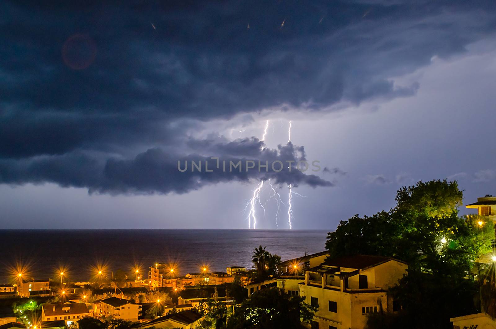 Lightning over the sea by marcorubino