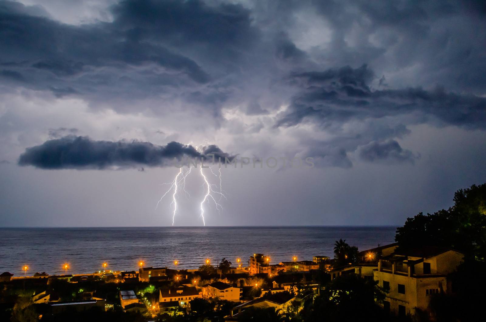 Lightning over the sea by marcorubino