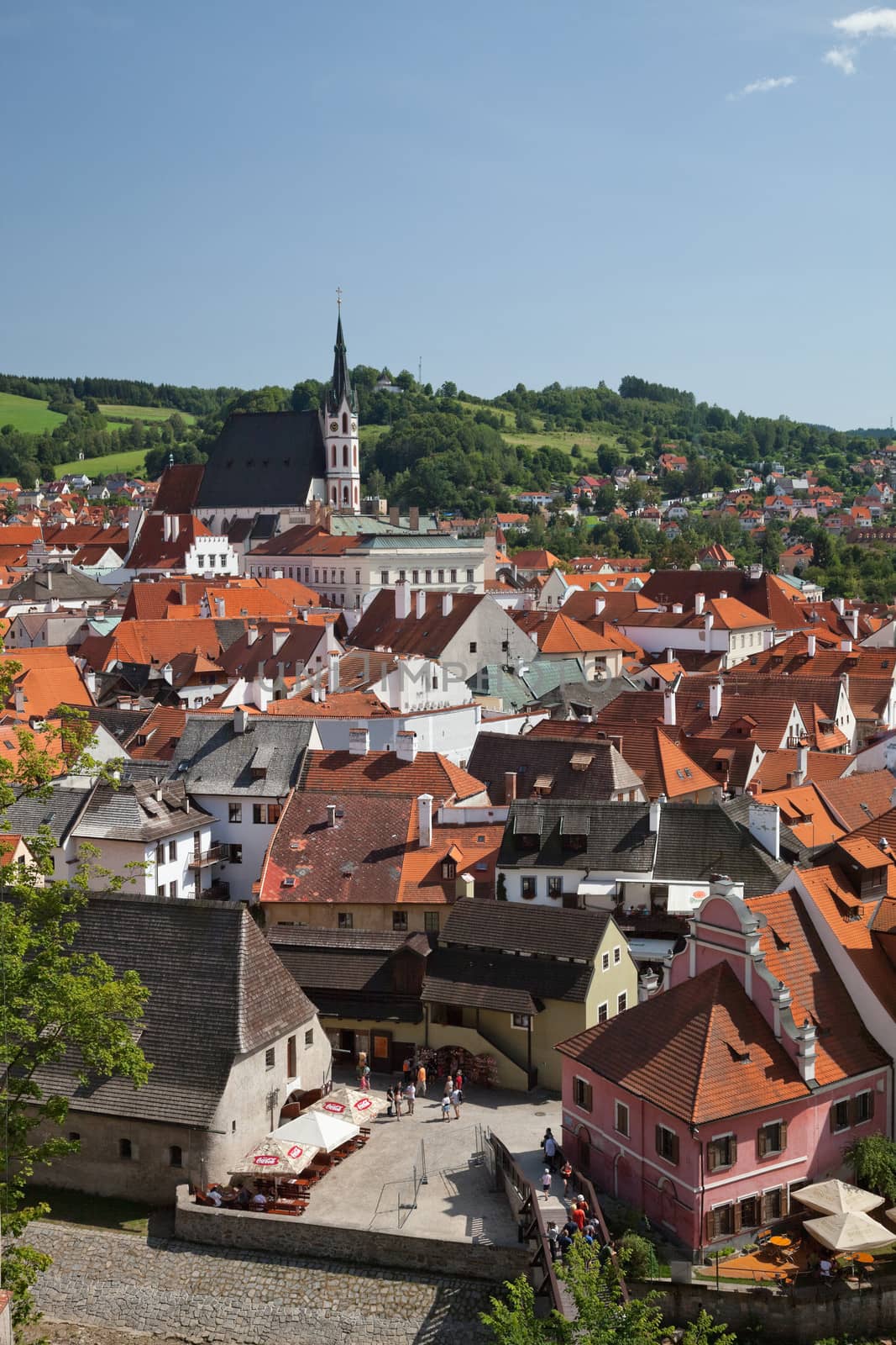 CESKY KRUMLOV, CZECH REPUBLIC, AUGUST 21, 2012: The St. Vit Church. The tourists visit the national treasure Cesky Krumlov saved by UNESCO since 1992.