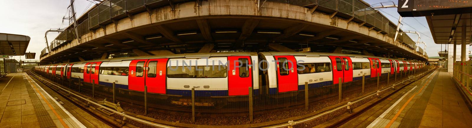 London underground. Long subway train ready to leave the station.