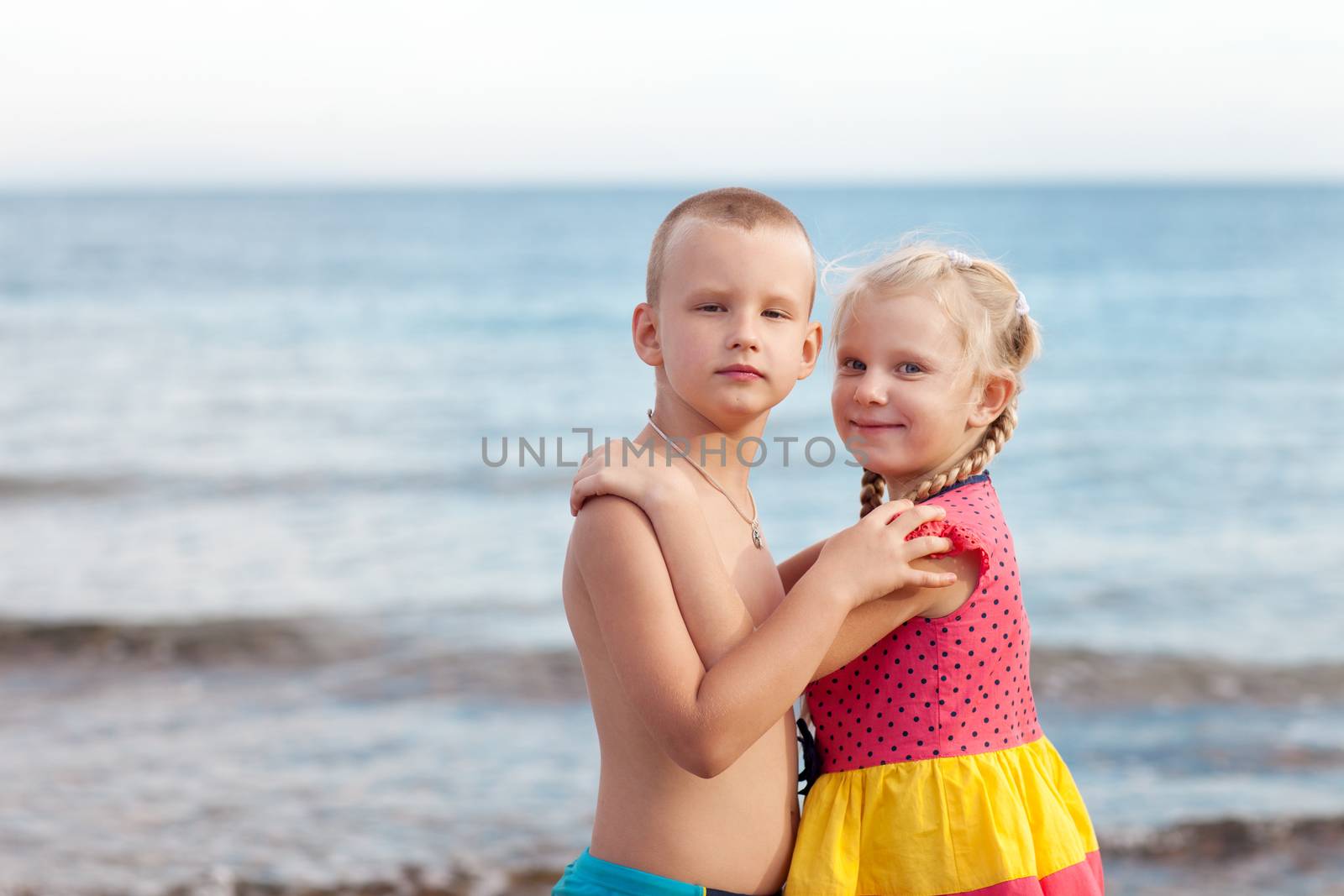 portrait of two children on the beach